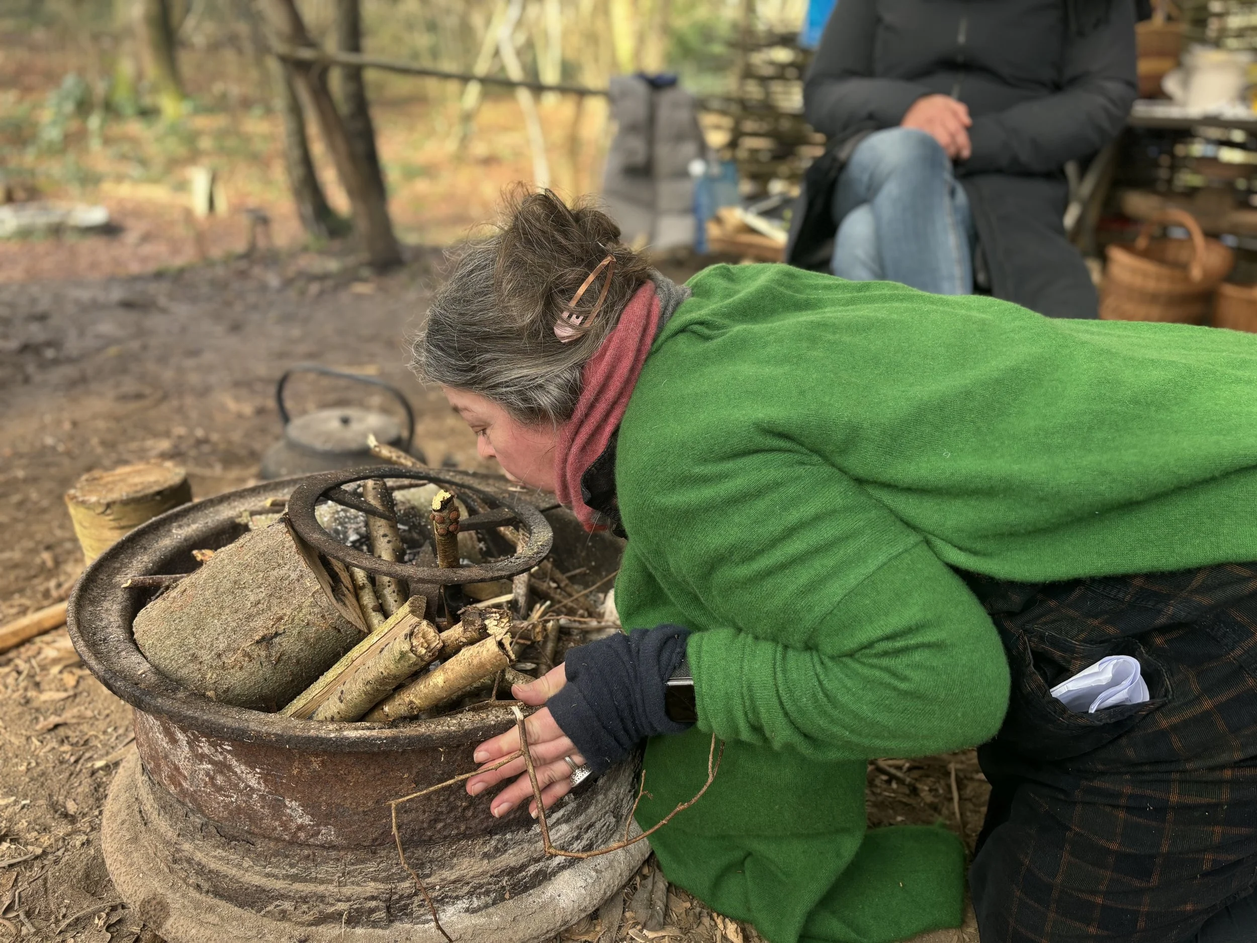 Emma of the woods fire tending.jpeg