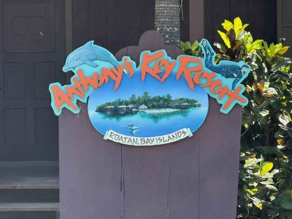 Anthony's Key Resort sign with a diver and dolphin, Roatán, Bay Islands