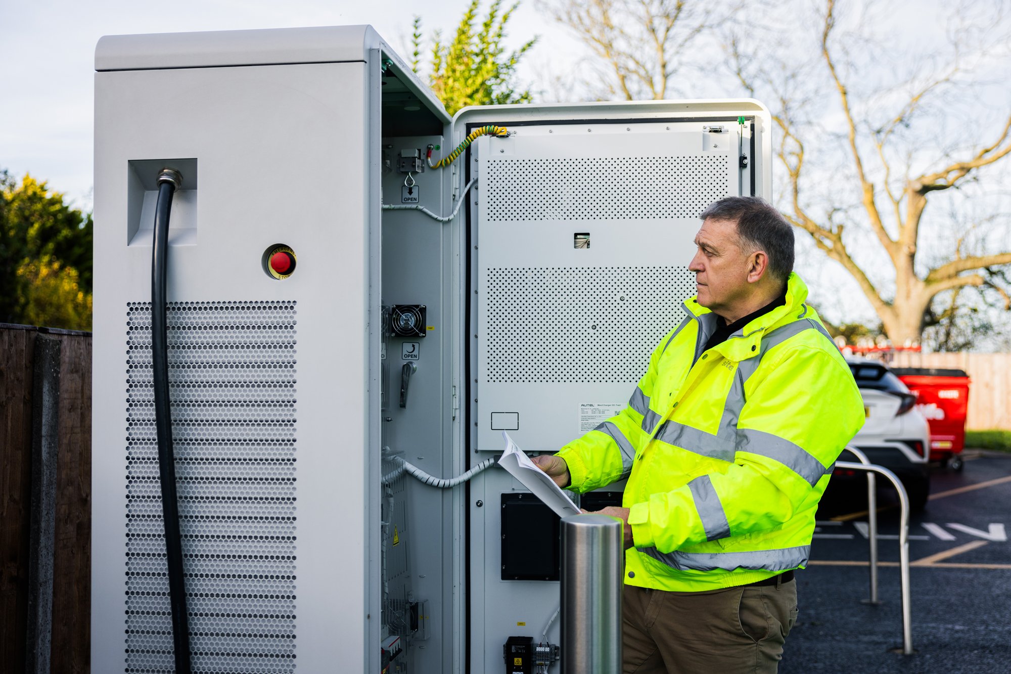 Man servicing EV machine