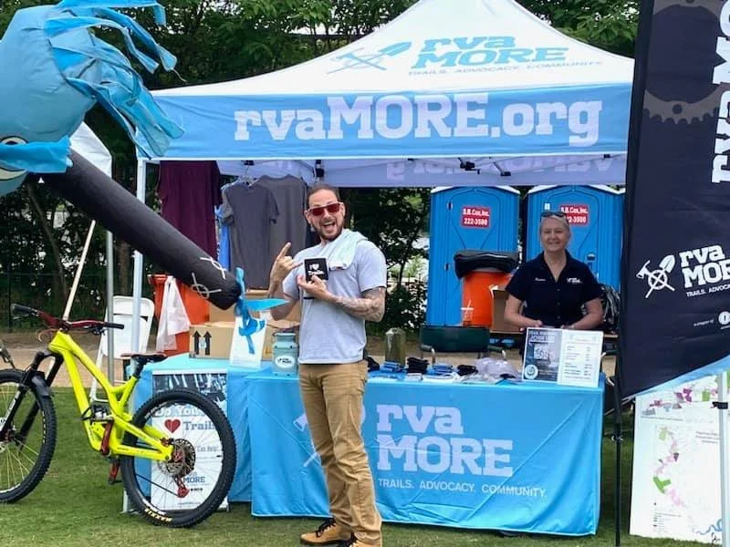 Volunteer sharing the word about mountain biking