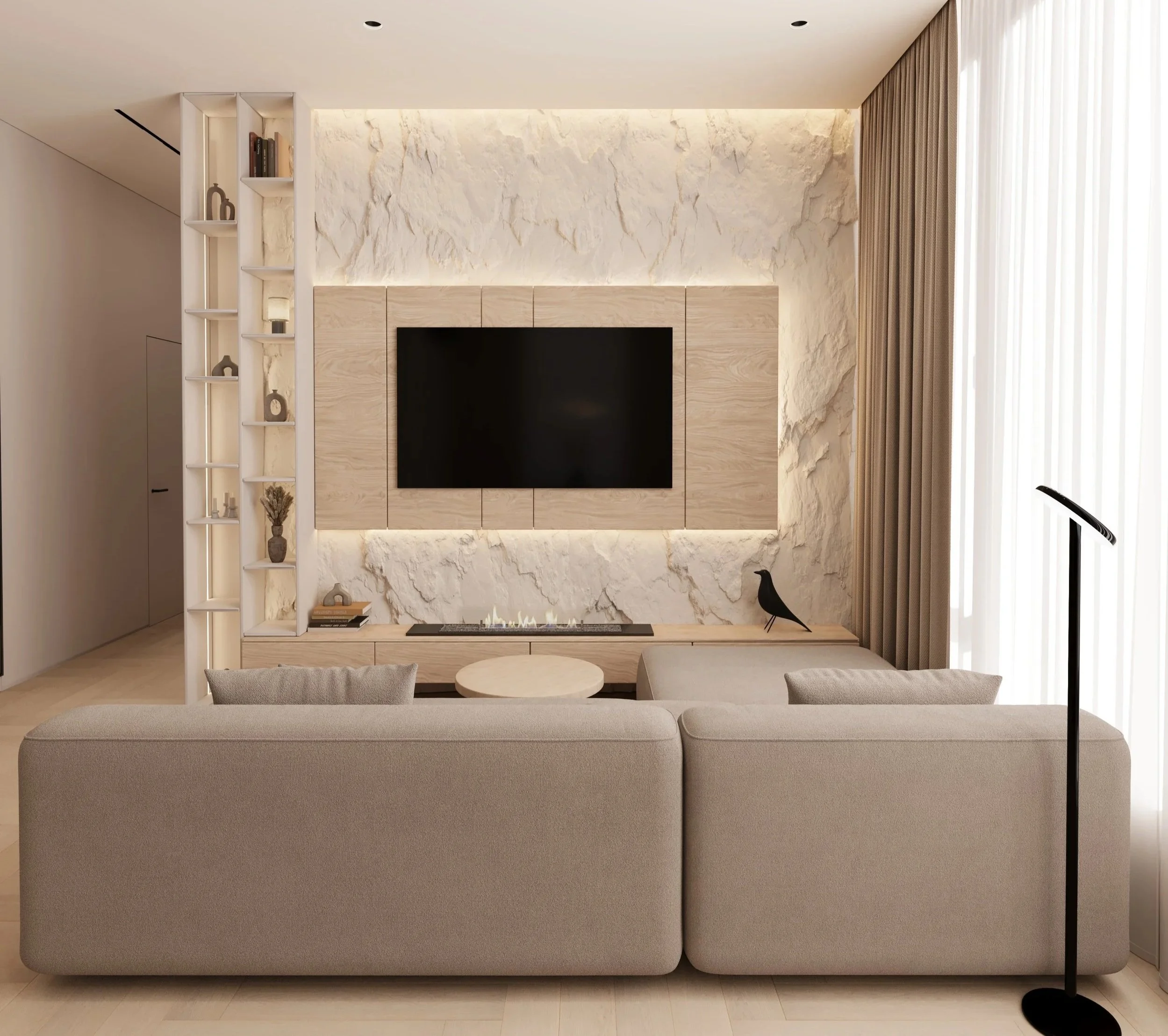 Modern living room with beige sofa, wall-mounted flat-screen TV, textured white stone wall, large window with beige curtains, decorative black bird sculpture, contemporary black floor lamp, and built-in shelves with decorative items.