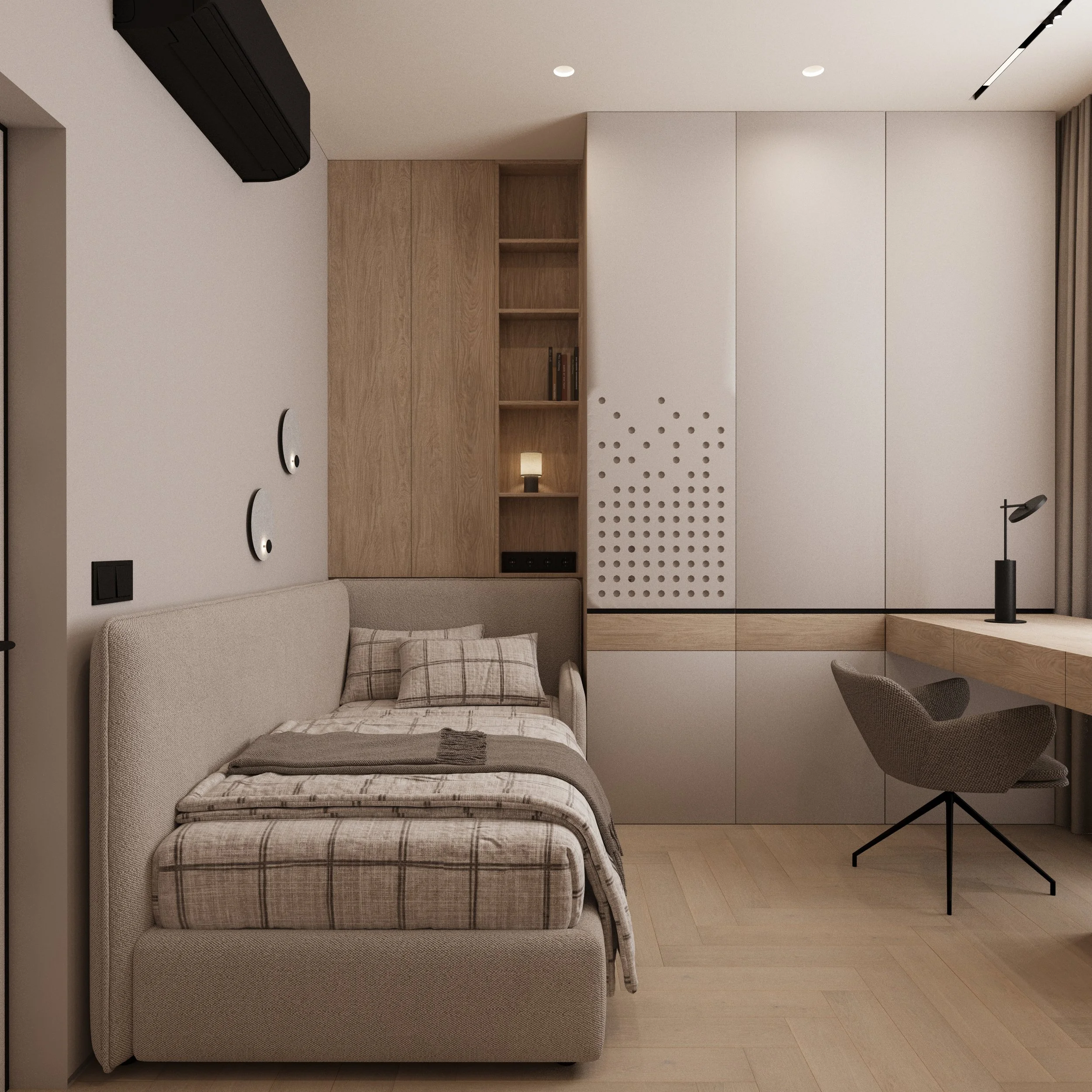 Modern bedroom with a beige upholstered bed, open wooden shelving with books and a small lamp, a closet with wooden accents, a desk with a black lamp, and a brown chair.