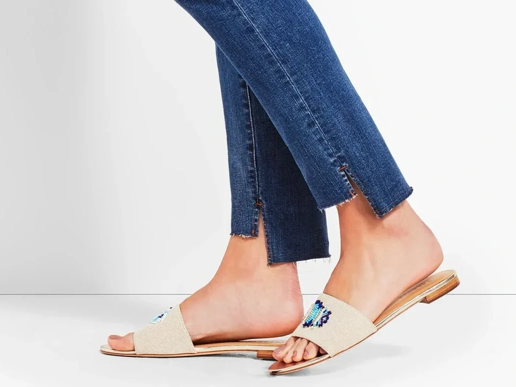 A pair of jeans with a step hem. Longer in the back and shorter in the front with a "step" between them, rather than a diagonal cut.