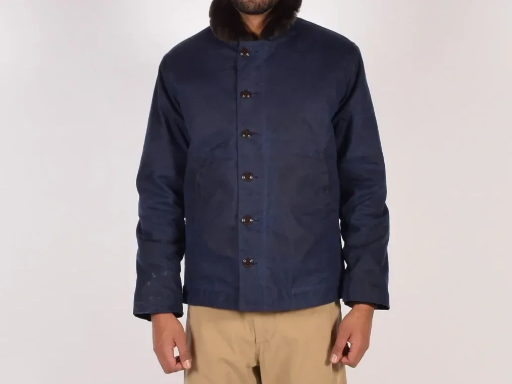 Man in a navy deck jacket