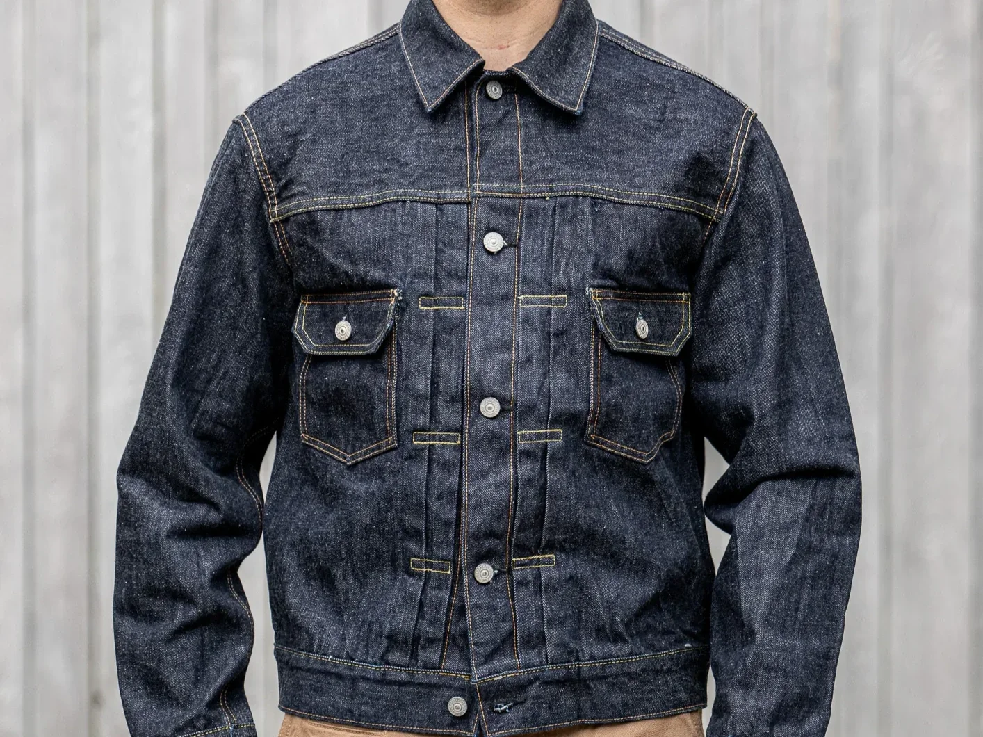 Man in a denim jacket with two chest pockets