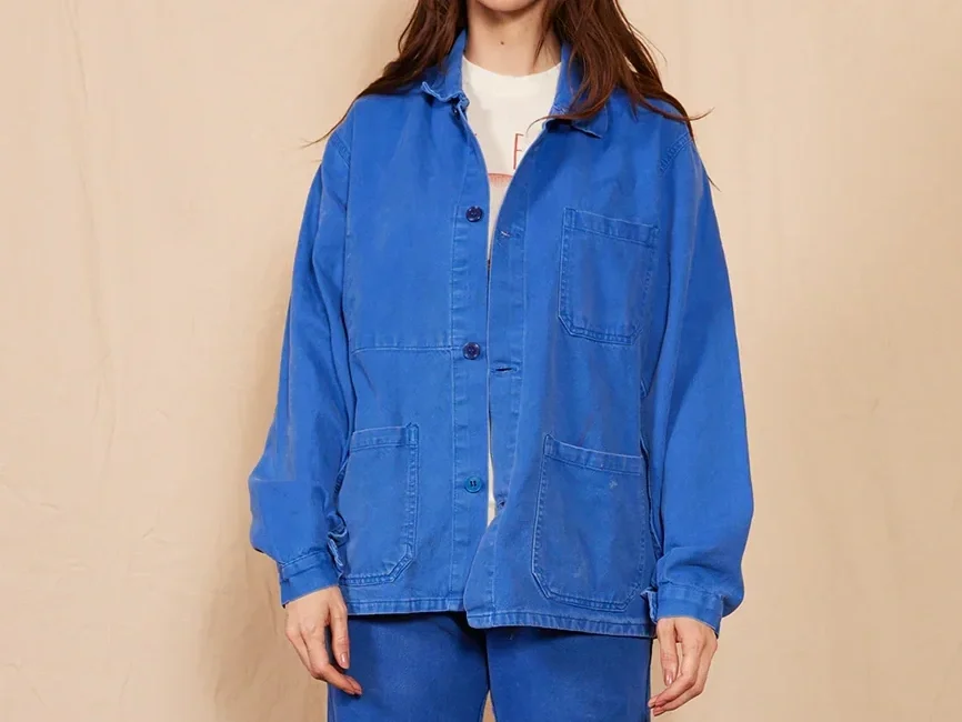 Woman in a blue chore coat