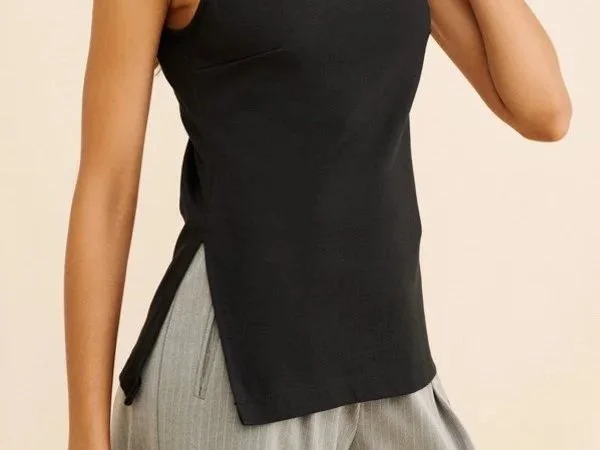 Woman in a black side slit top