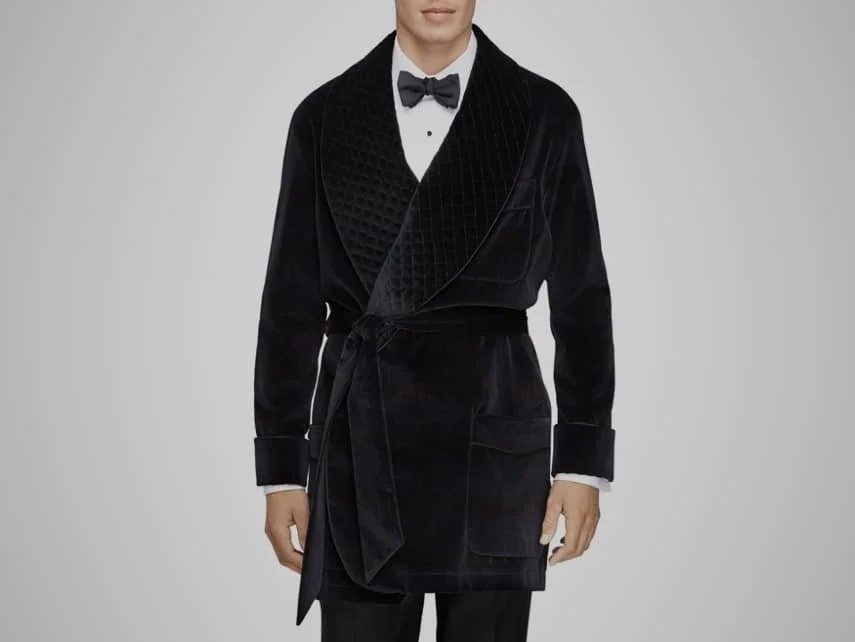 Man in a black velvet smoking jacket