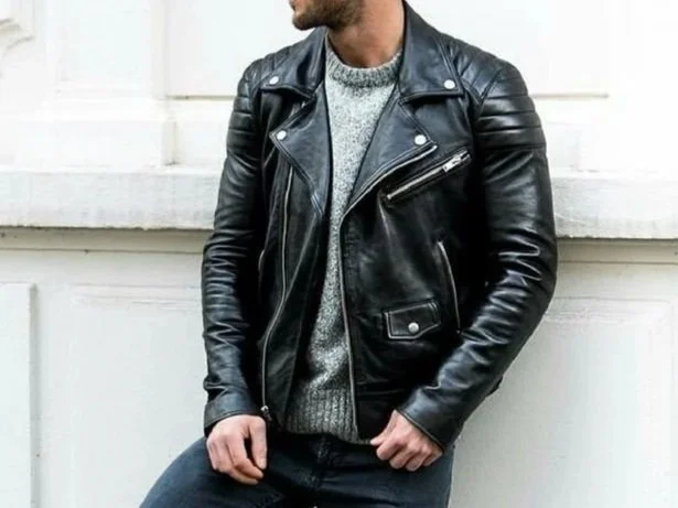 Man in a black leather biker jacket