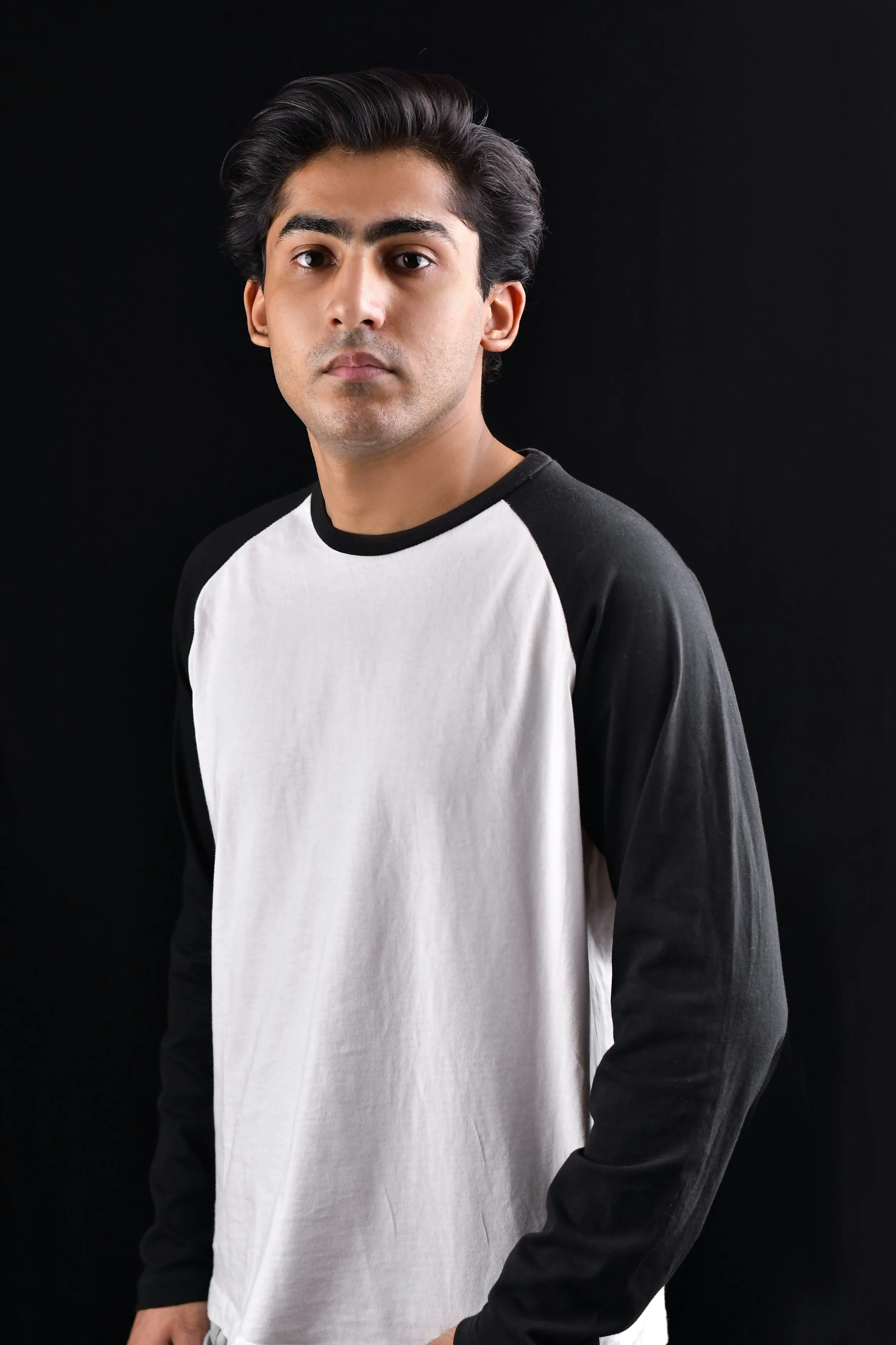 Man in a black and white raglan shirt