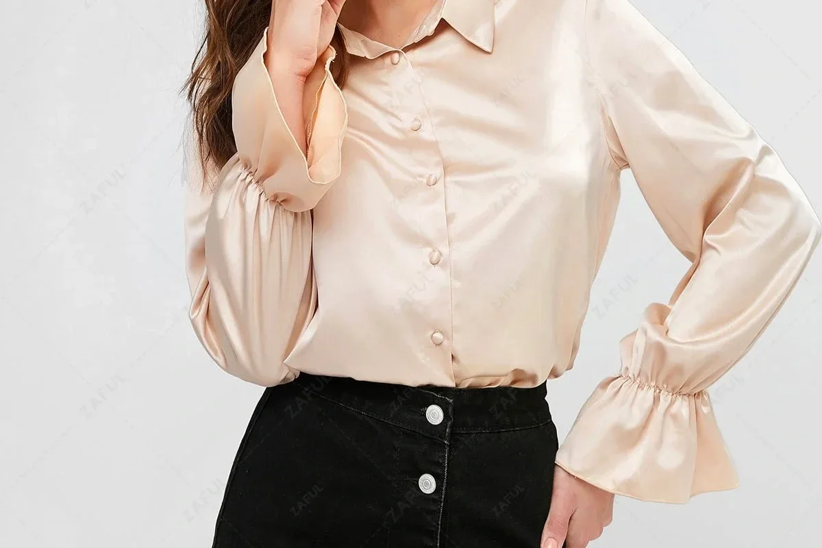 Woman in an ivory poet sleeve blouse