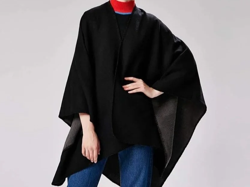 Woman in a black poncho