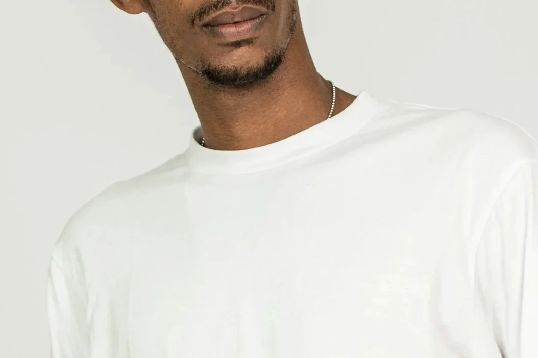 Man in a white crew neck sweatshirt