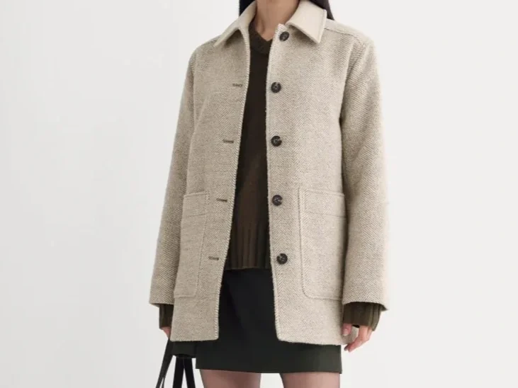 Woman in a taupe car coat