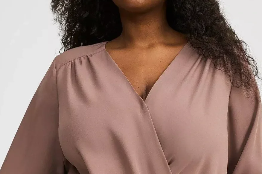 Woman in a pink surplice top