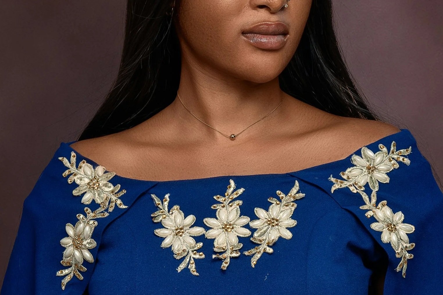 Woman in a blue off-the-shoulder dress