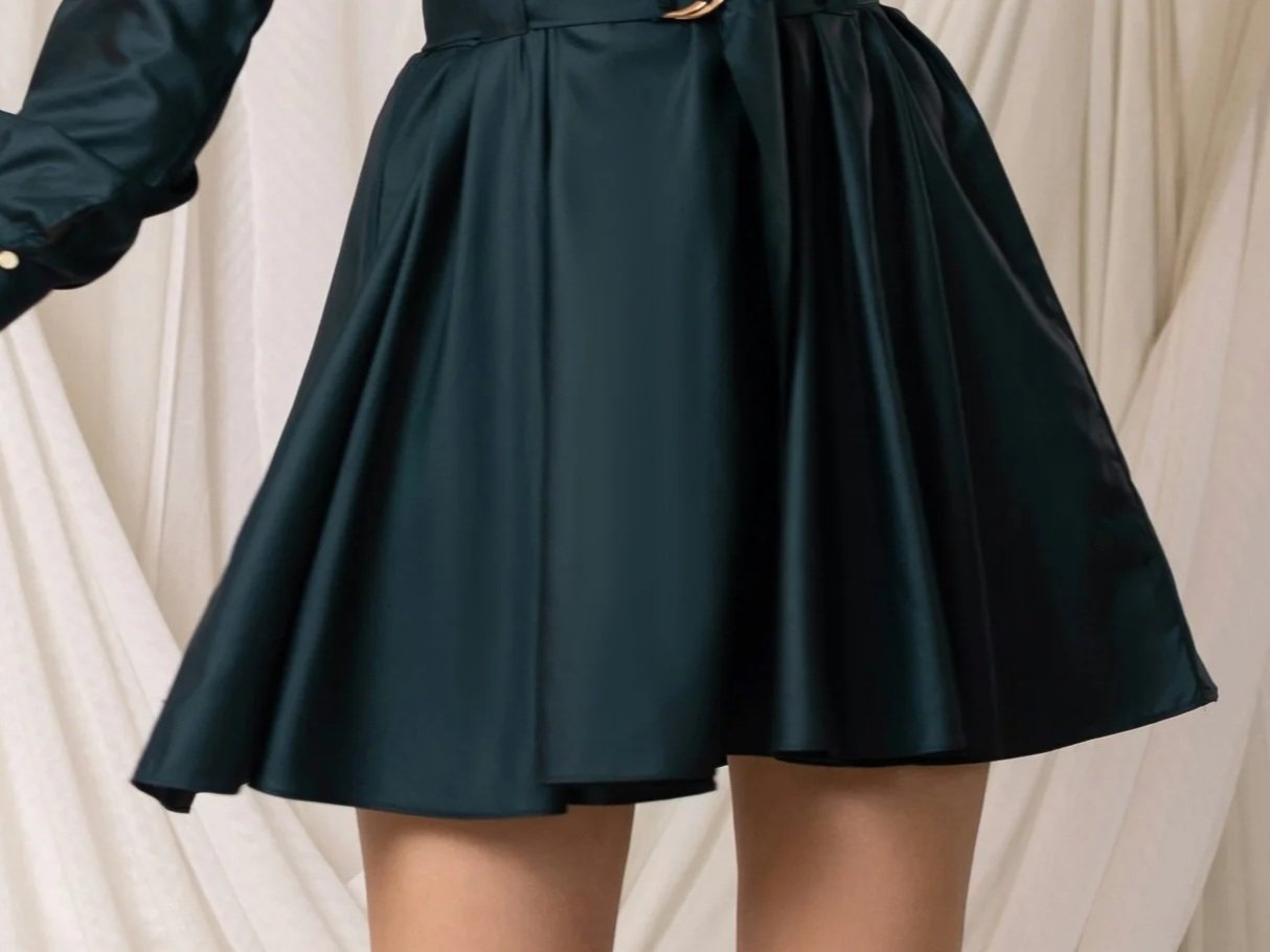 Woman in a jade minidress