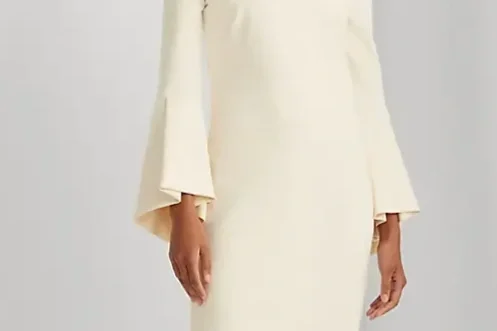 Woman in a white bell sleeve dress