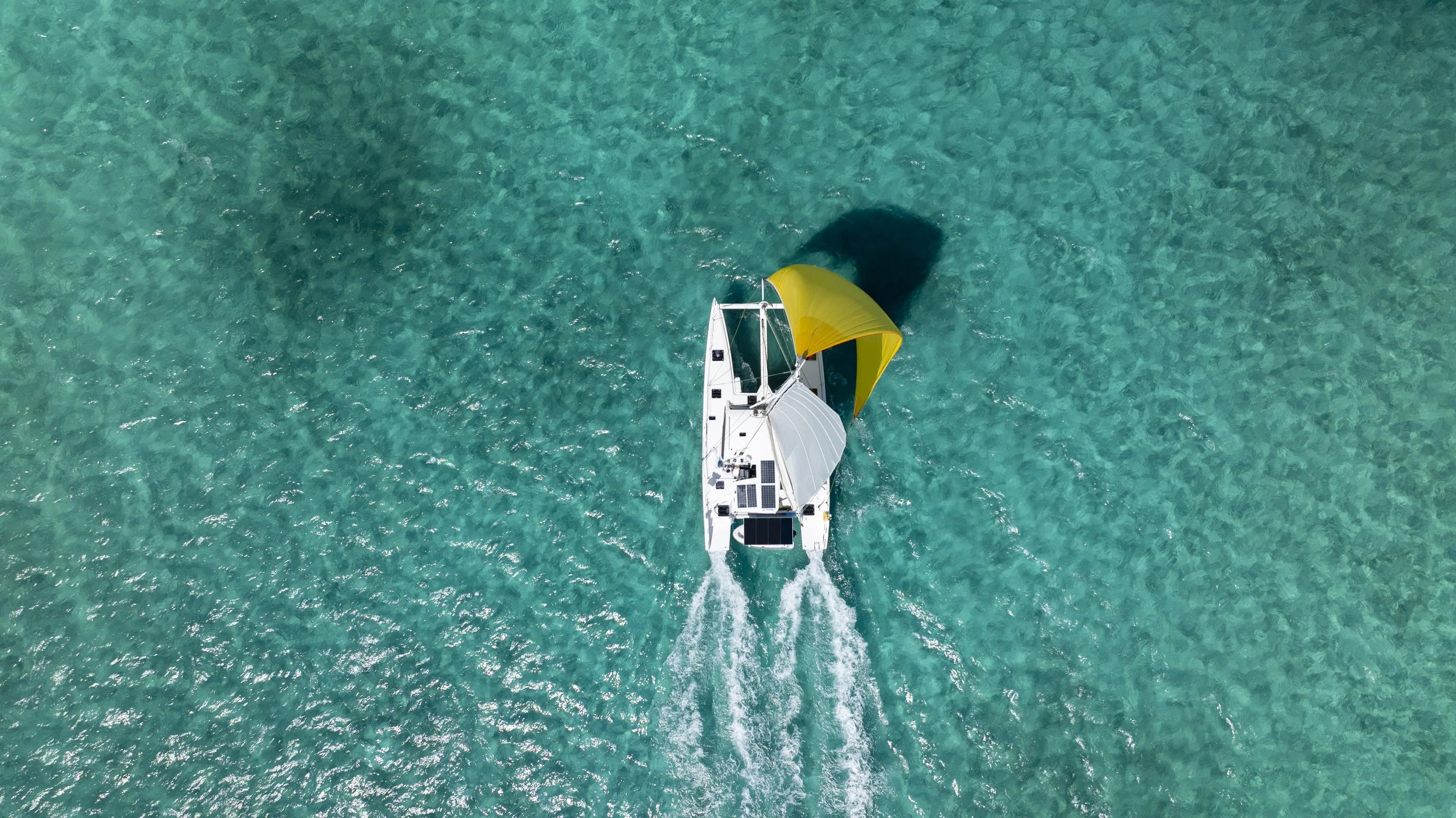 An Outremer Catamaran gliding on a blue as possible sea. The Bahamas!