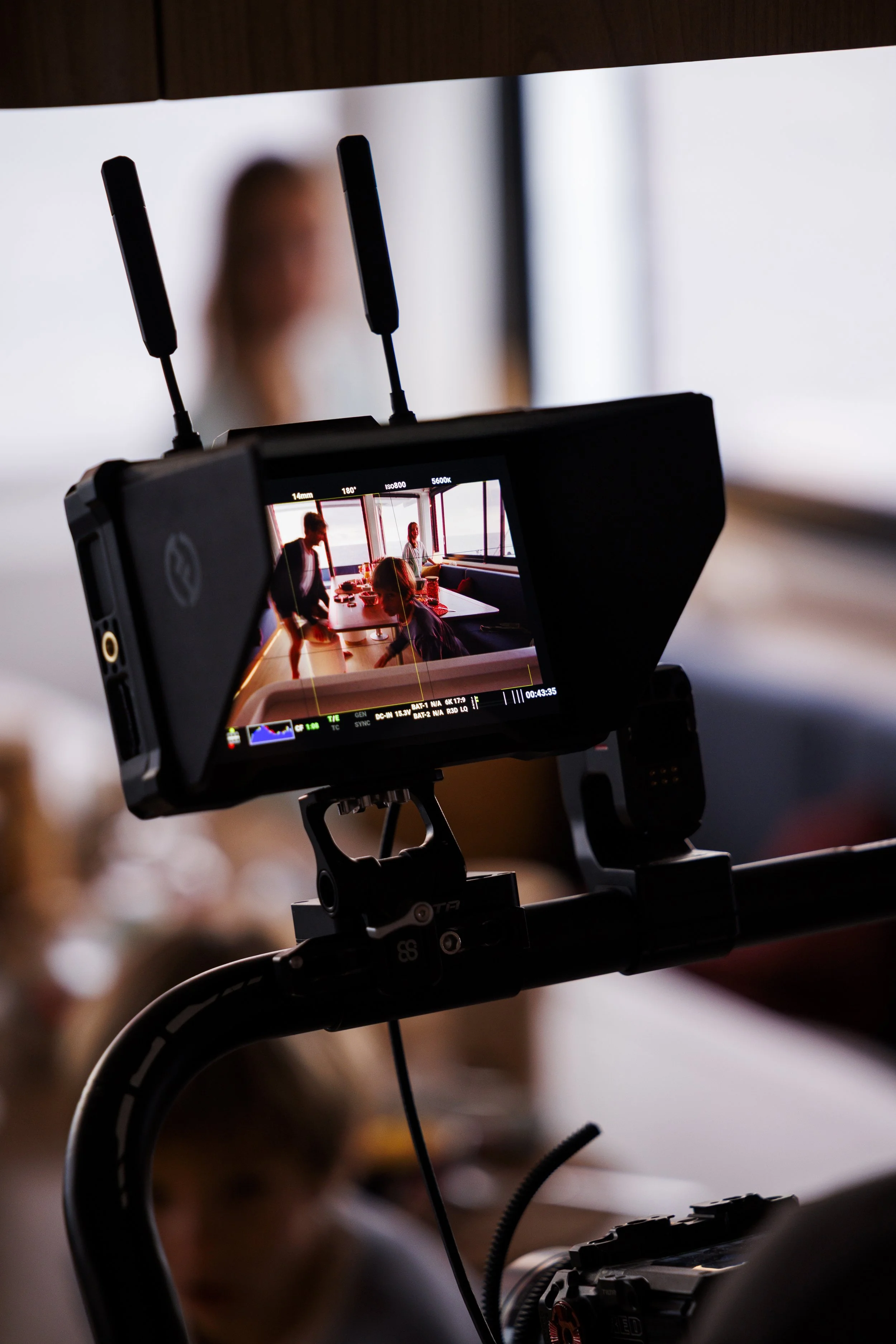 Camera on record, with a close up on a family eating on a luxury boat.