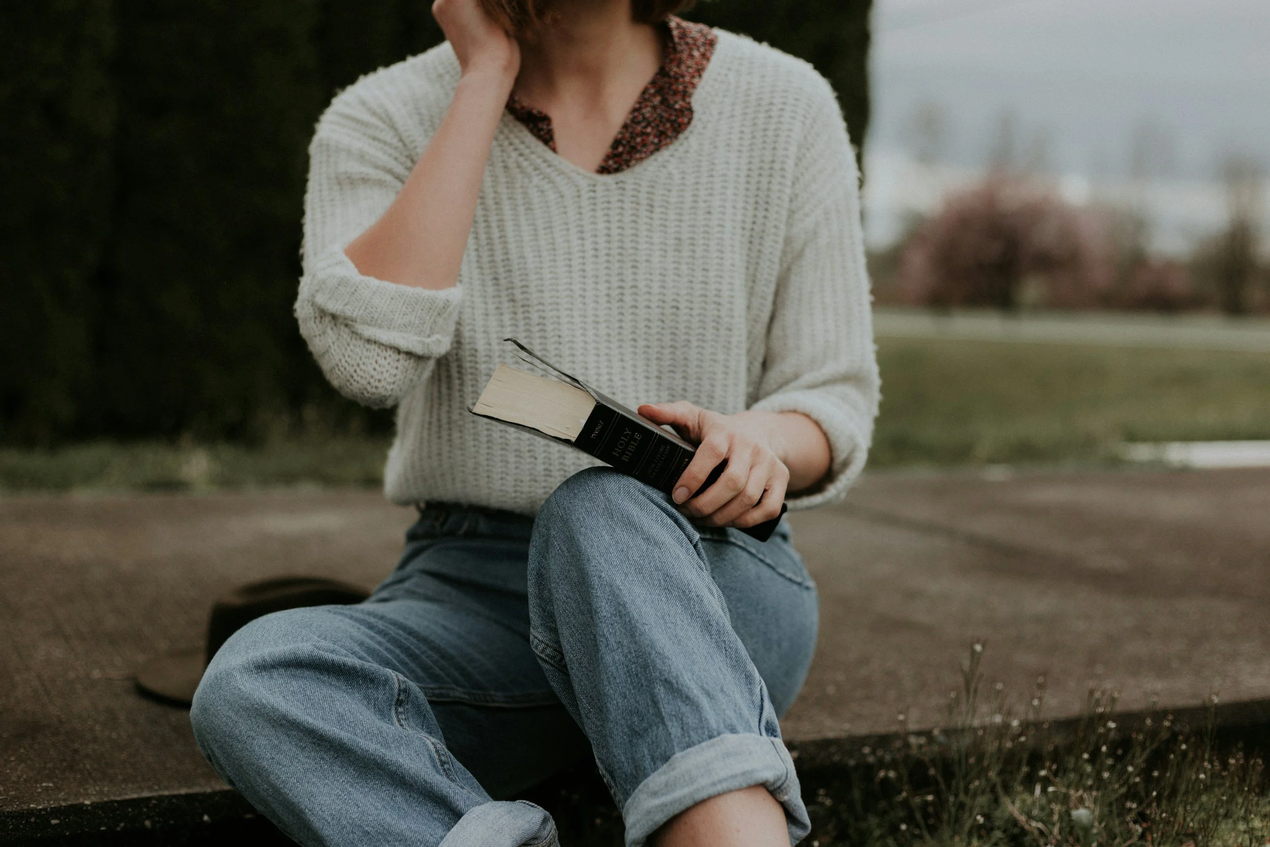 bible study resources with woman holding the Bible