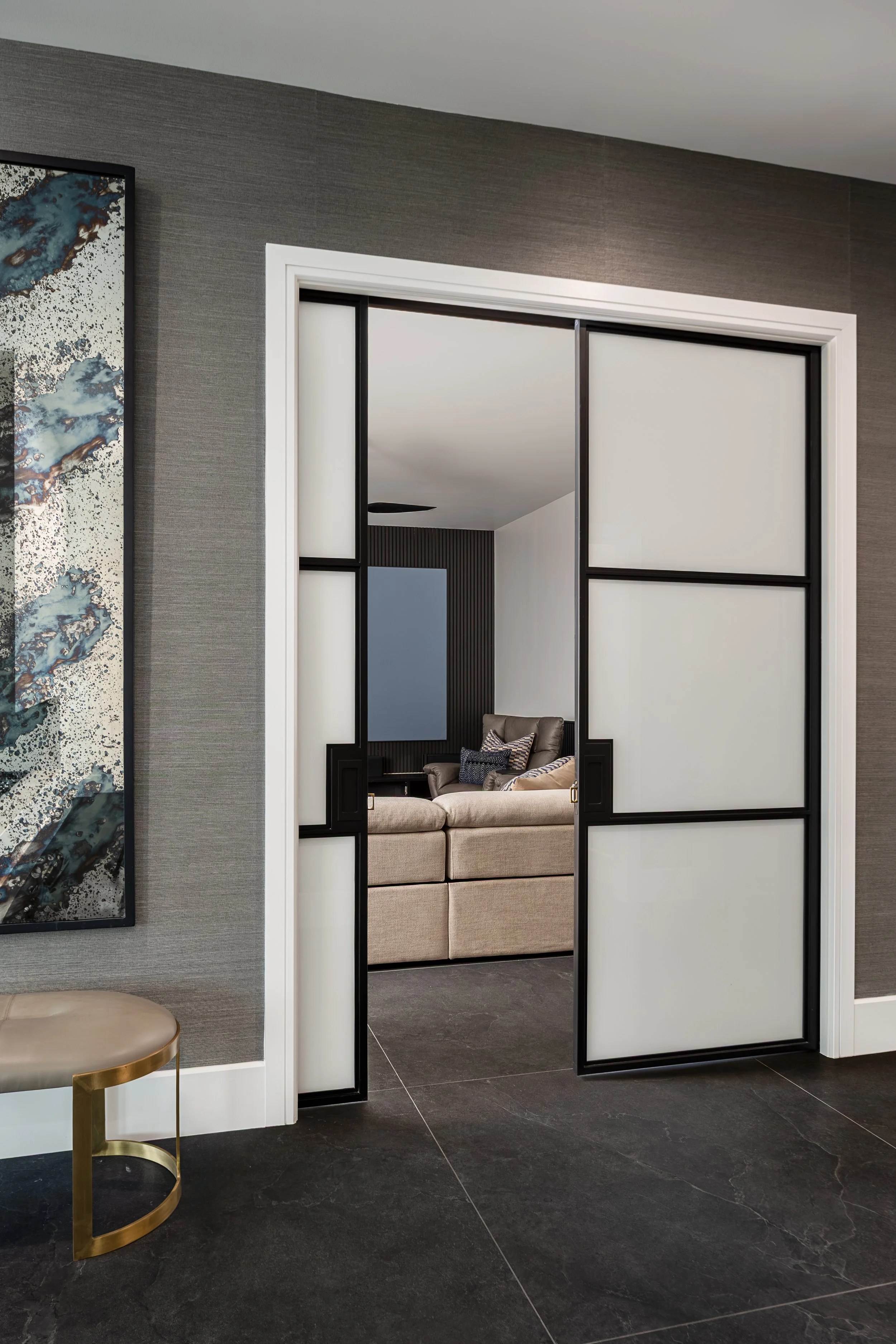 Movie Room of a modern condo in Downtown Columbus Ohio showcasing the luxury interior design of Benham + Co Interior Design.
