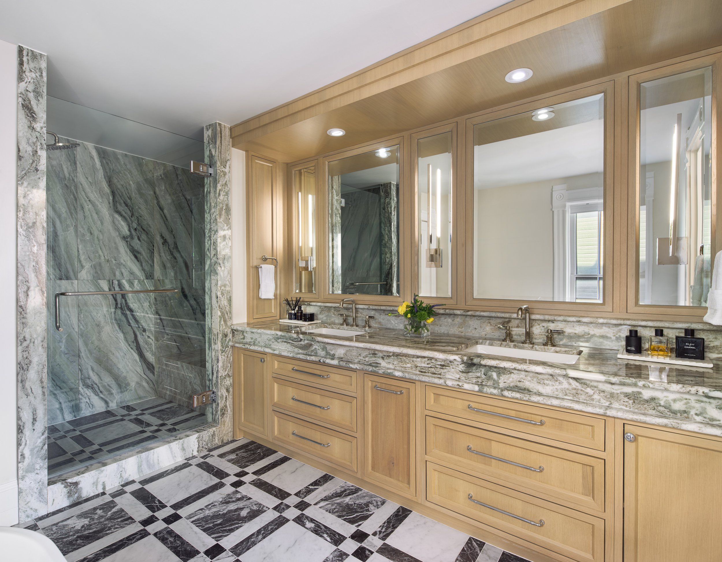 This luxurious primary bathroom renovation in a historic Columbus, Ohio home showcases the refined craftsmanship of Benham & Co Interior Design, a premier Columbus Ohio interior designer specializing in high-end residential remodeling and custom inte