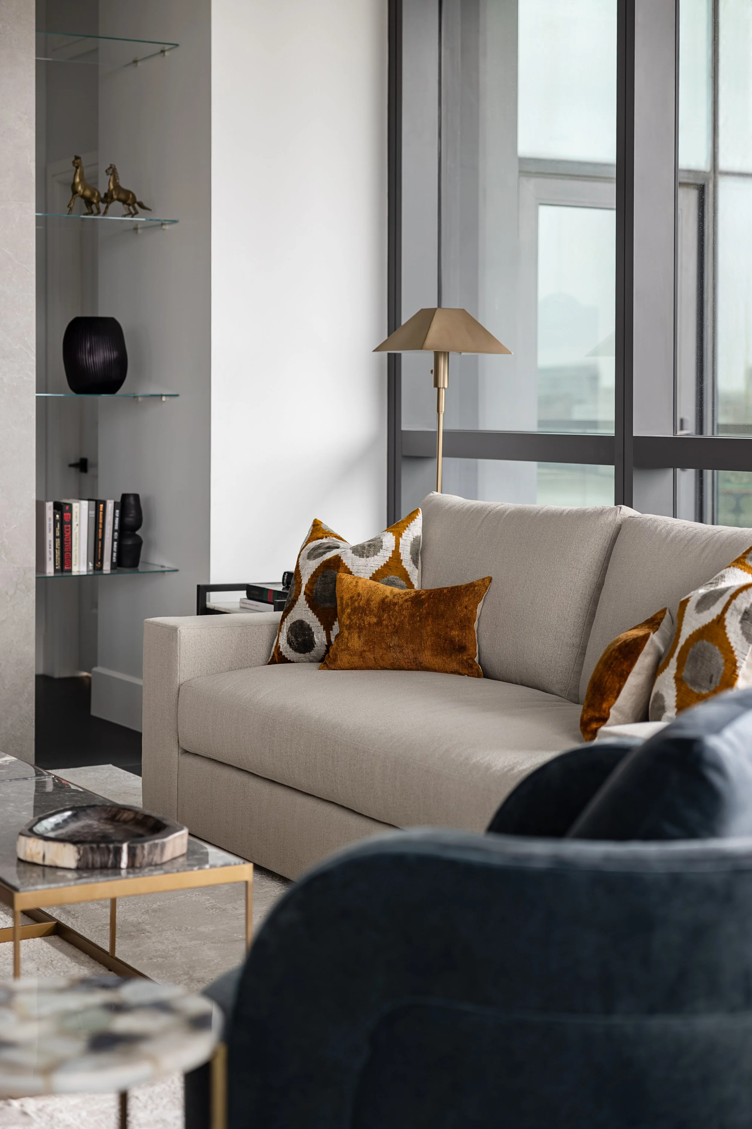 Close up image of a sofa in a modern condo in Downtown Columbus Ohio showcasing the luxury interior design of Benham + Co Interior Design.