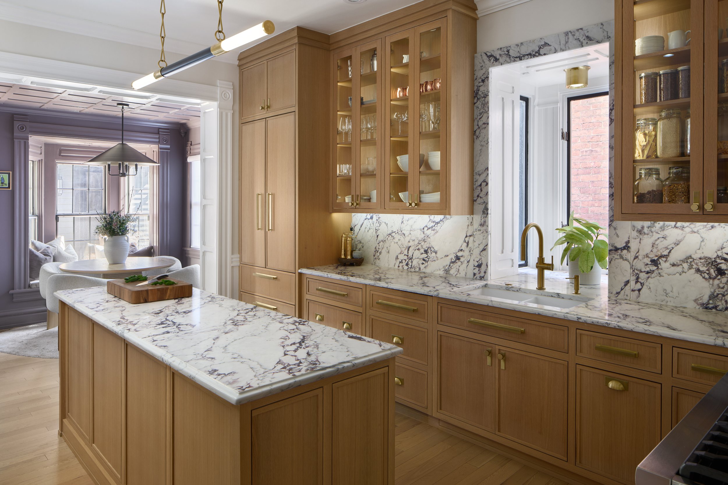 This luxury kitchen renovation in a historic Victorian home in Columbus, Ohio was designed by Benham & Co Interior Design, a premier Columbus Ohio interior designer specializing in high-end kitchen design and full-service renovations. The space featu