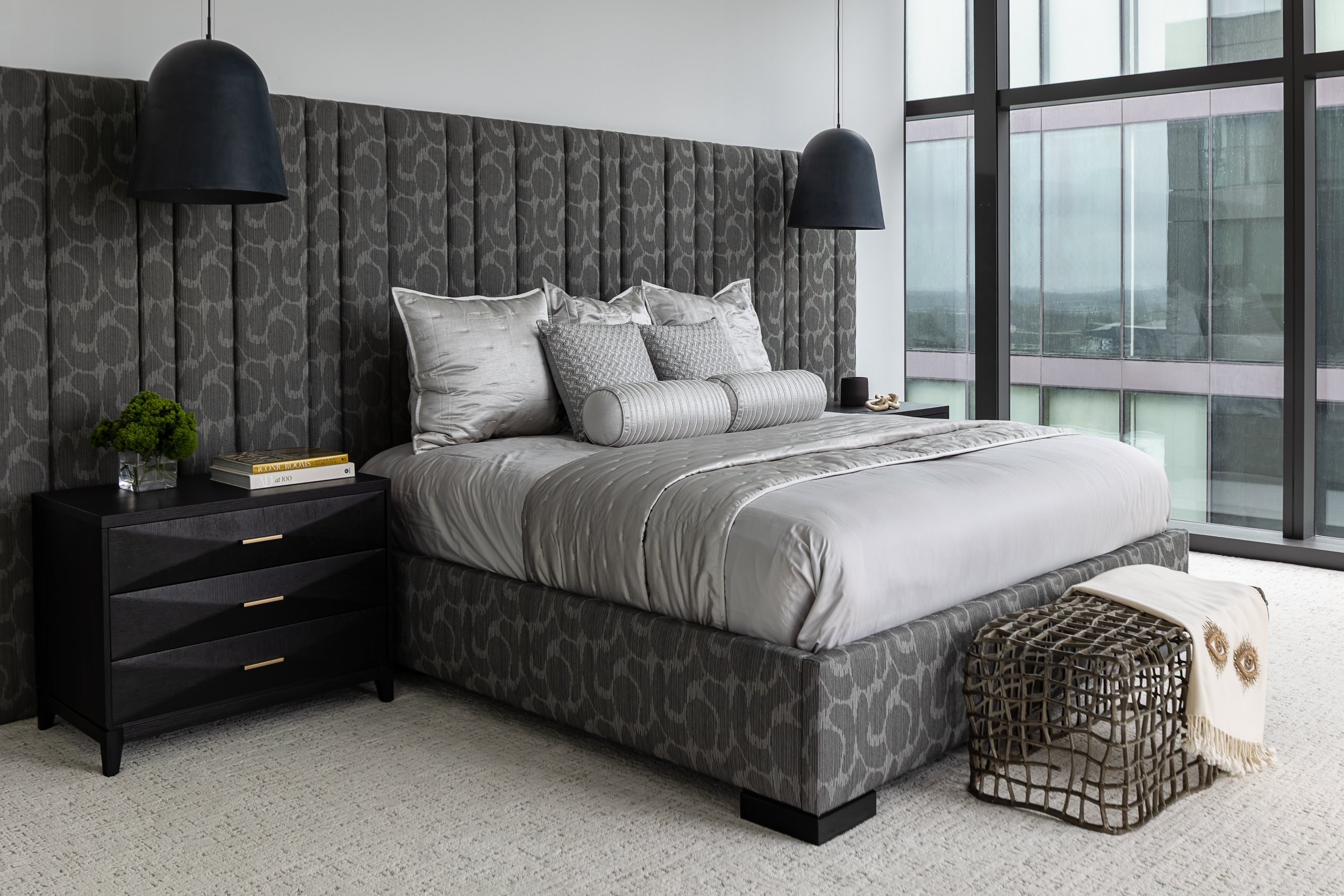 Primary Bedroom of a modern condo in Downtown Columbus Ohio showcasing the luxury interior design of Benham + Co Interior Design.