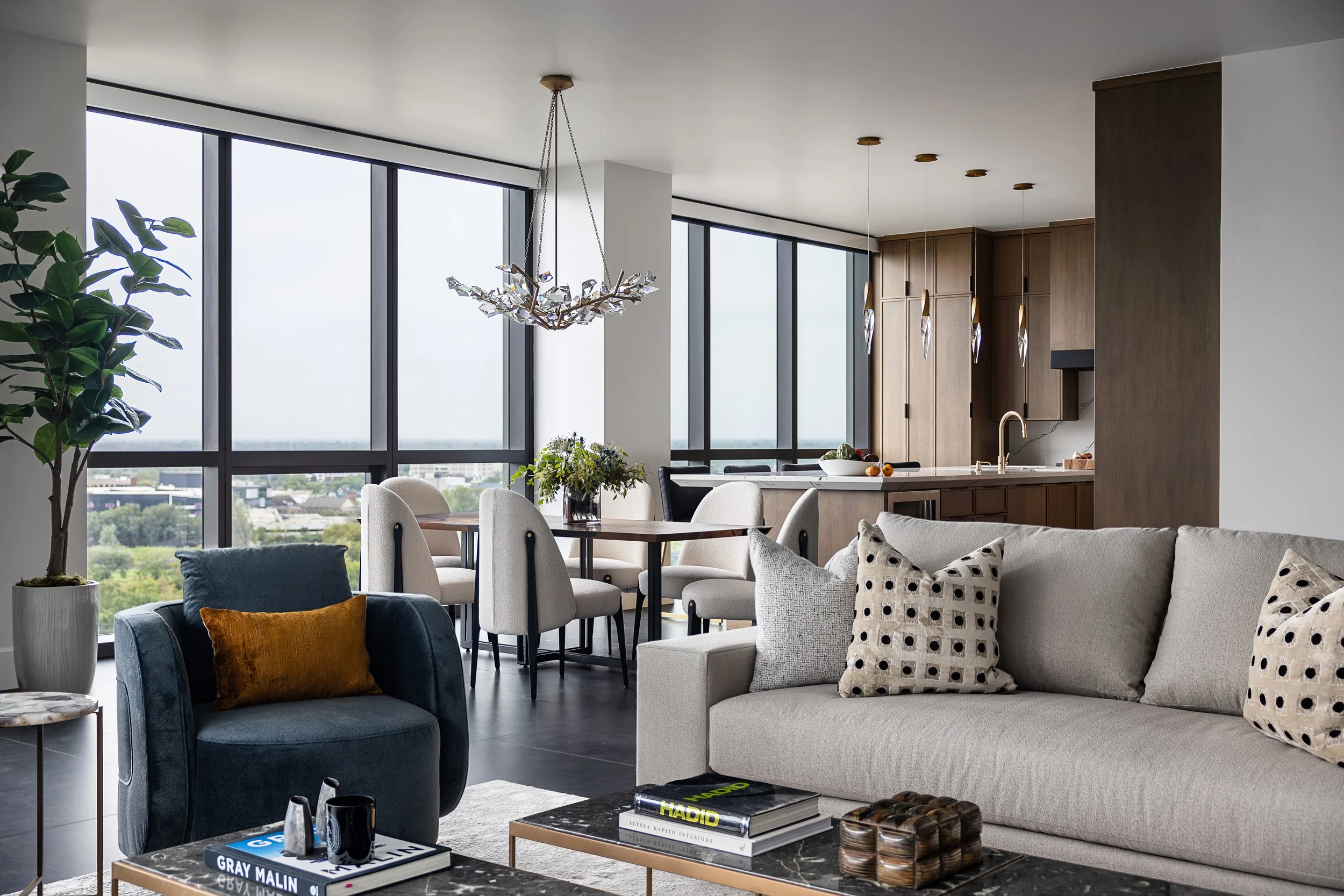 Living Room and Dining room of a modern condo in Downtown Columbus Ohio showcasing the luxury interior design of Benham + Co Interior Design.