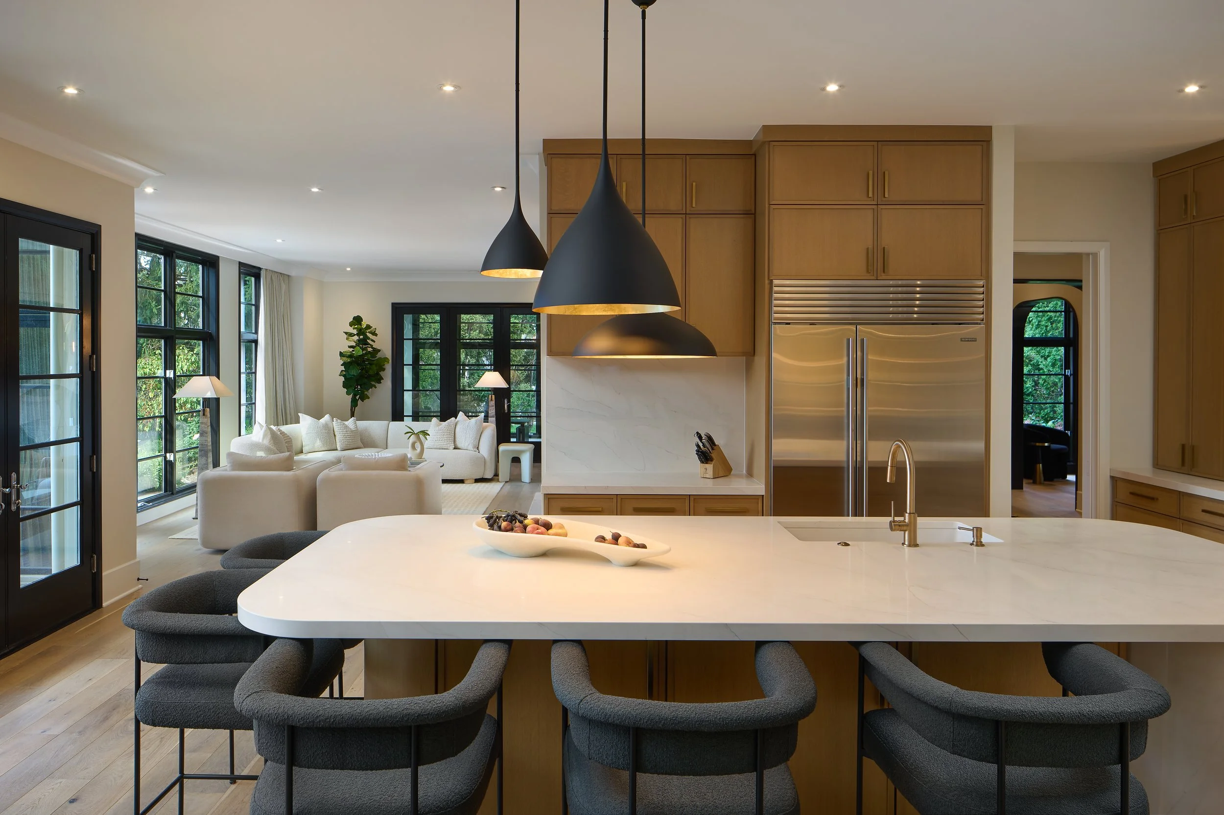 This modern kitchen renovation in Bexley, Ohio by Benham & Co Interior Design, a leading Columbus Ohio interior designer specializing in full-service interior design and full home remodels, showcases a perfect balance of warmth and contemporary style