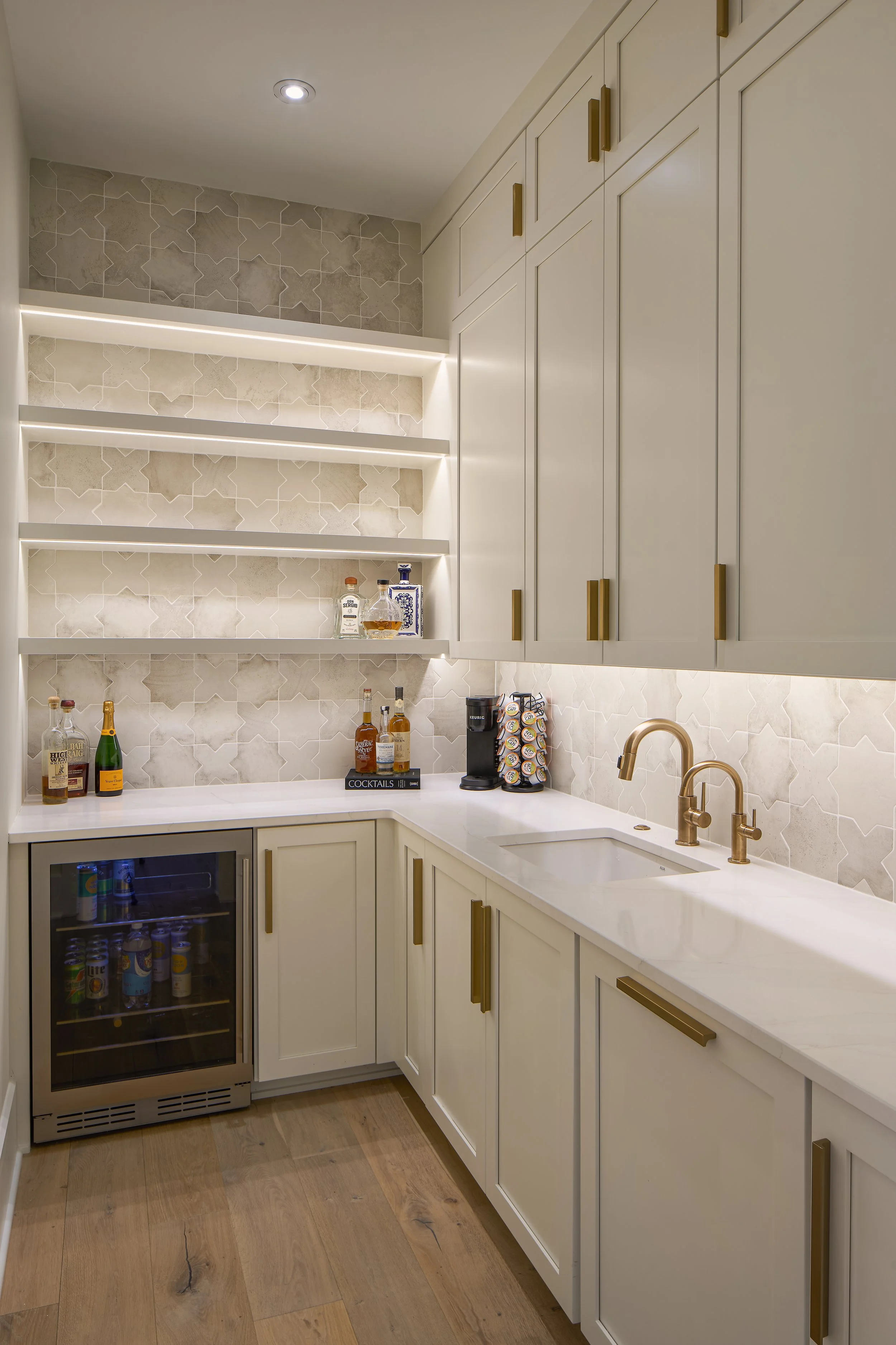 This custom bar and pantry in a fully remodeled home in Bexley, Ohio was designed by Benham & Co Interior Design, a top Columbus Ohio interior designer specializing in full-service interior design and luxury home renovations. Featuring custom cabinet