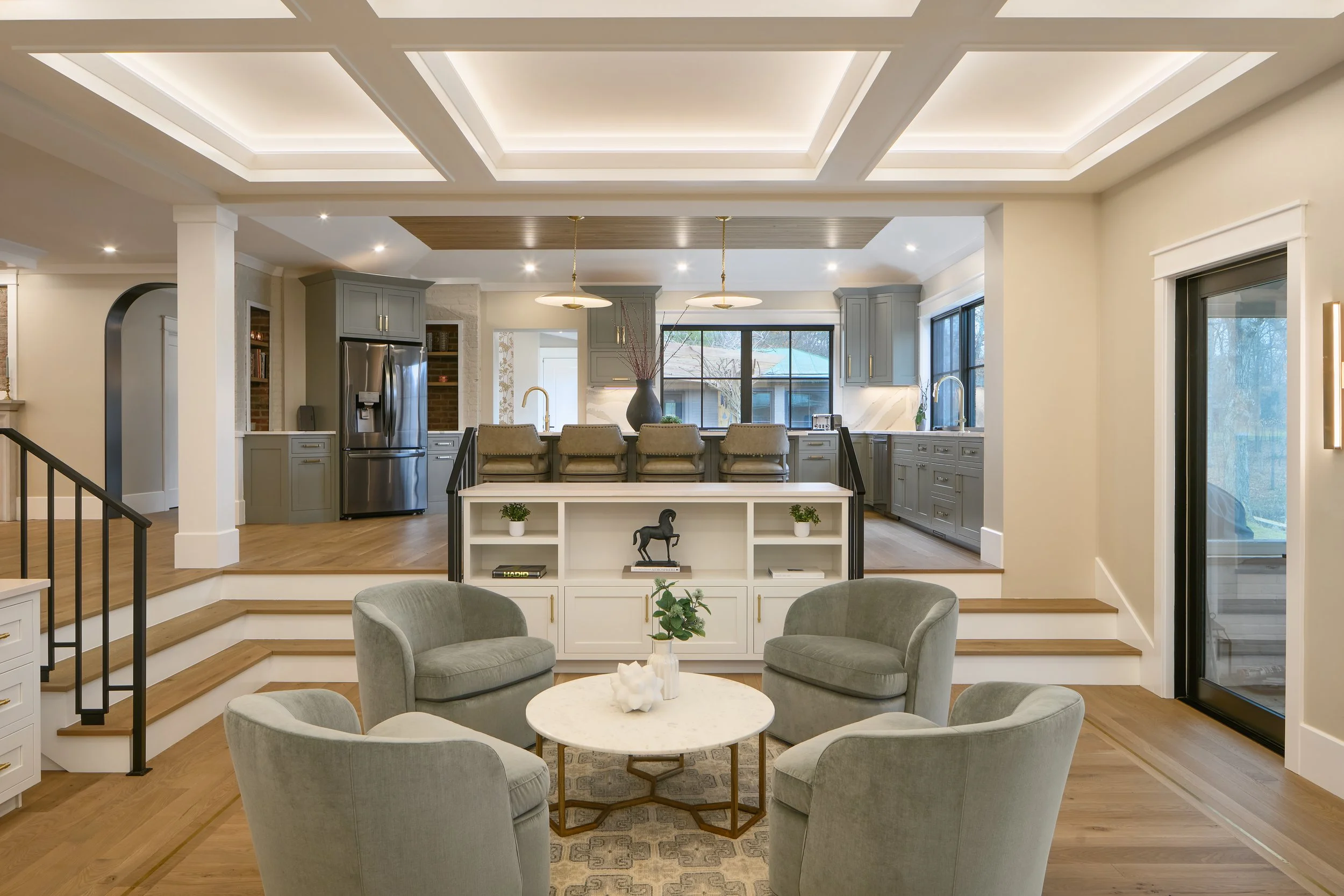 This custom open-concept living space by Benham & Co Interior Design, a premier Columbus Ohio interior designer, showcases a refined approach to luxury residential interior design in Westerville, Ohio. The thoughtfully designed layout seamlessly conn