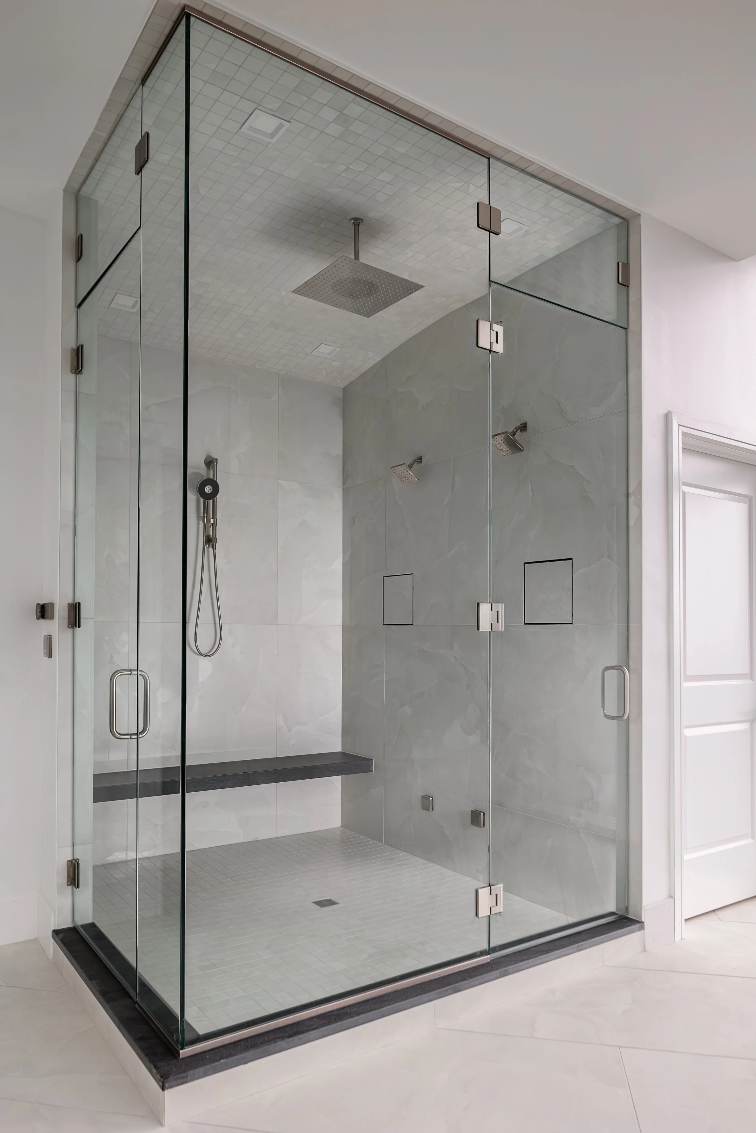 Shower of a modern condo in Downtown Columbus Ohio showcasing the luxury interior design of Benham + Co Interior Design.