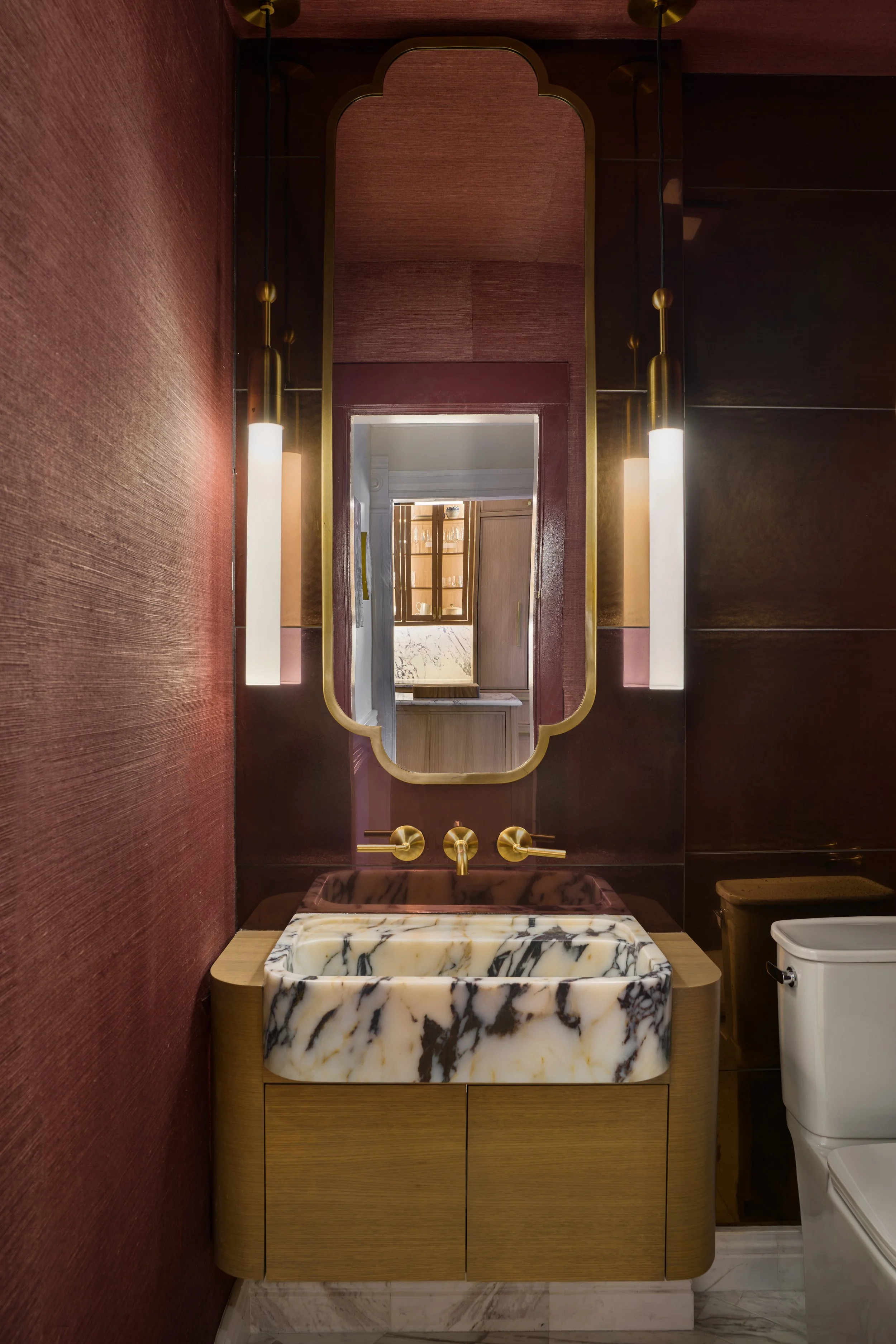 This custom powder room in a historic Victorian home in Columbus, Ohio was designed by Benham & Co Interior Design, a premier Columbus Ohio interior designer specializing in luxury residential interiors and full-service renovations. Featuring a drama