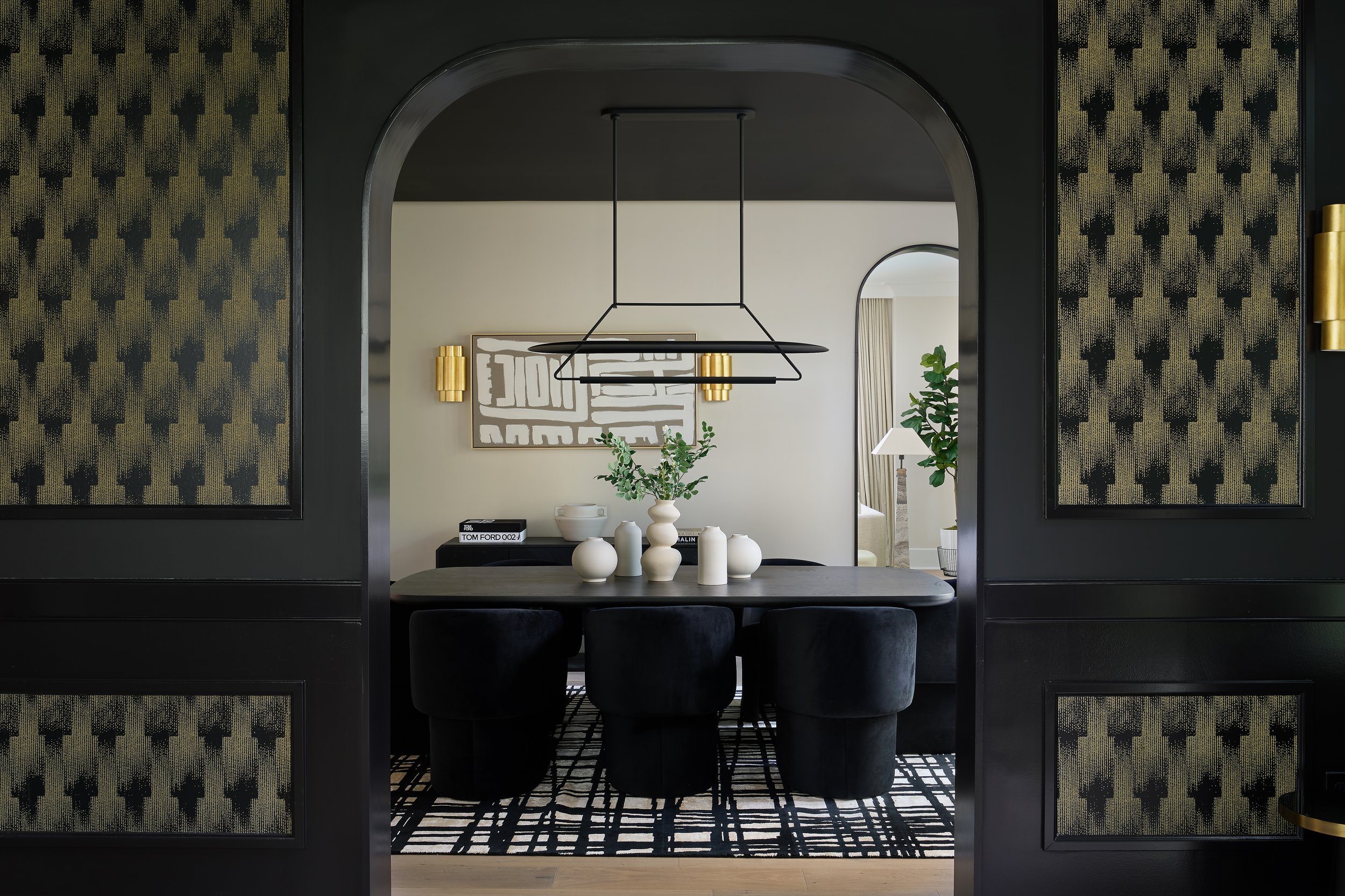 This sophisticated dining room in a fully remodeled home in Bexley, Ohio was designed by Benham & Co Interior Design, a premier Columbus Ohio interior designer specializing in full-service interior design and luxury home renovations. Framed by dramat