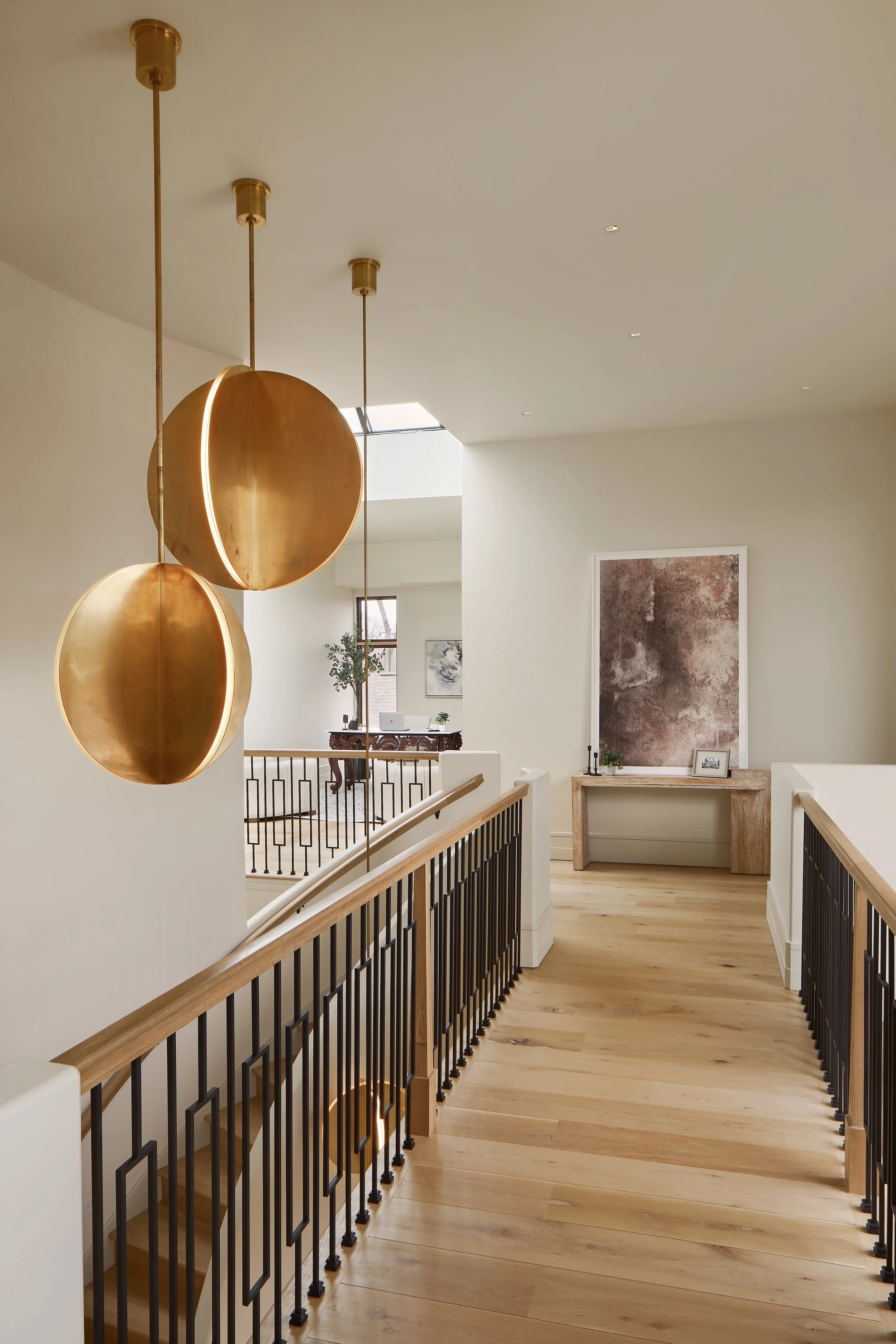 Modern Mediterranean hallway with Bau Visual Comfort Lighting located in Powell, Columbus, Ohio. Luxury Interior Design at it Best. 