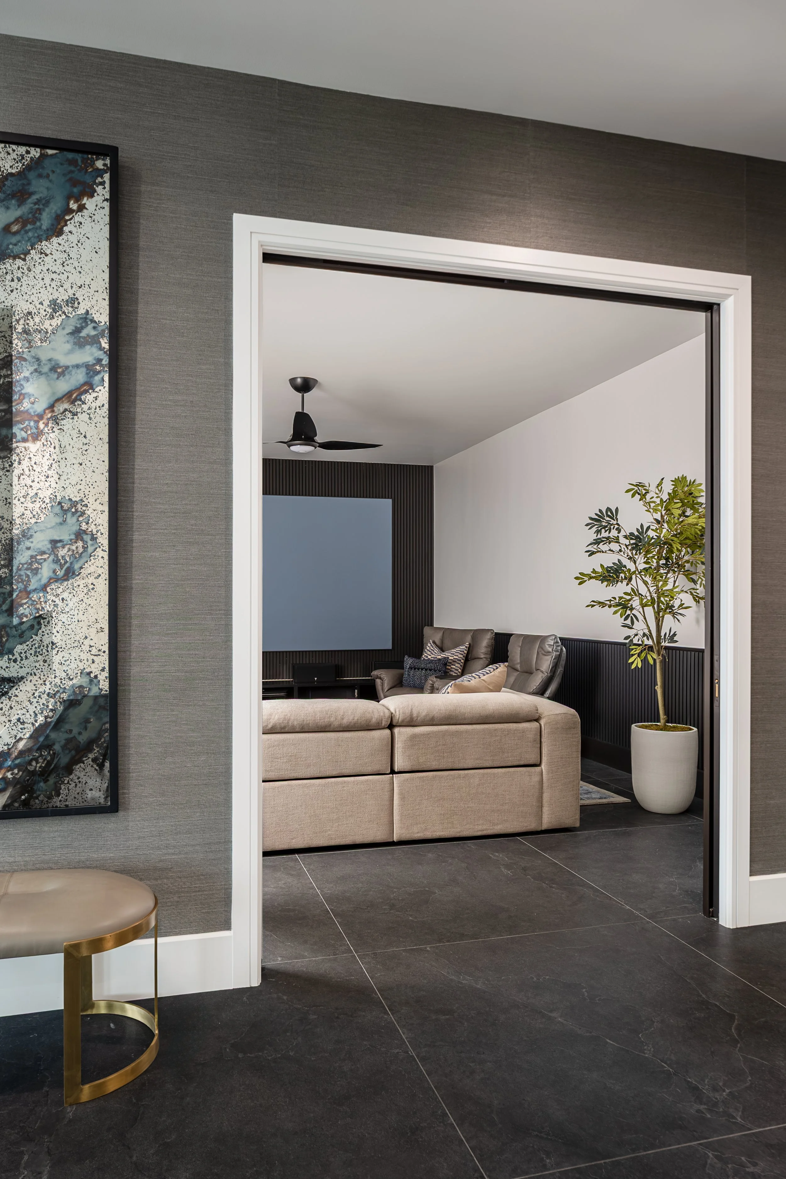 Movie Room of a modern condo in Downtown Columbus Ohio showcasing the luxury interior design of Benham + Co Interior Design.
