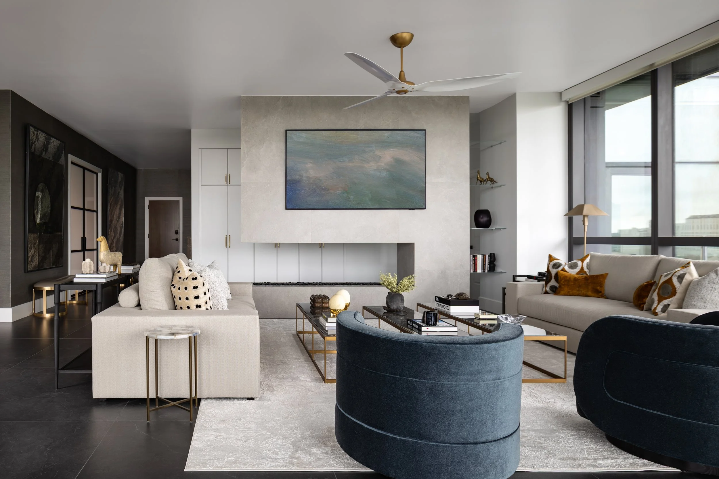 Im of a modern fireplace and living room in a  modern condo in Downtown Columbus Ohio showcasing the luxury interior design of Benham + Co Interior Design.