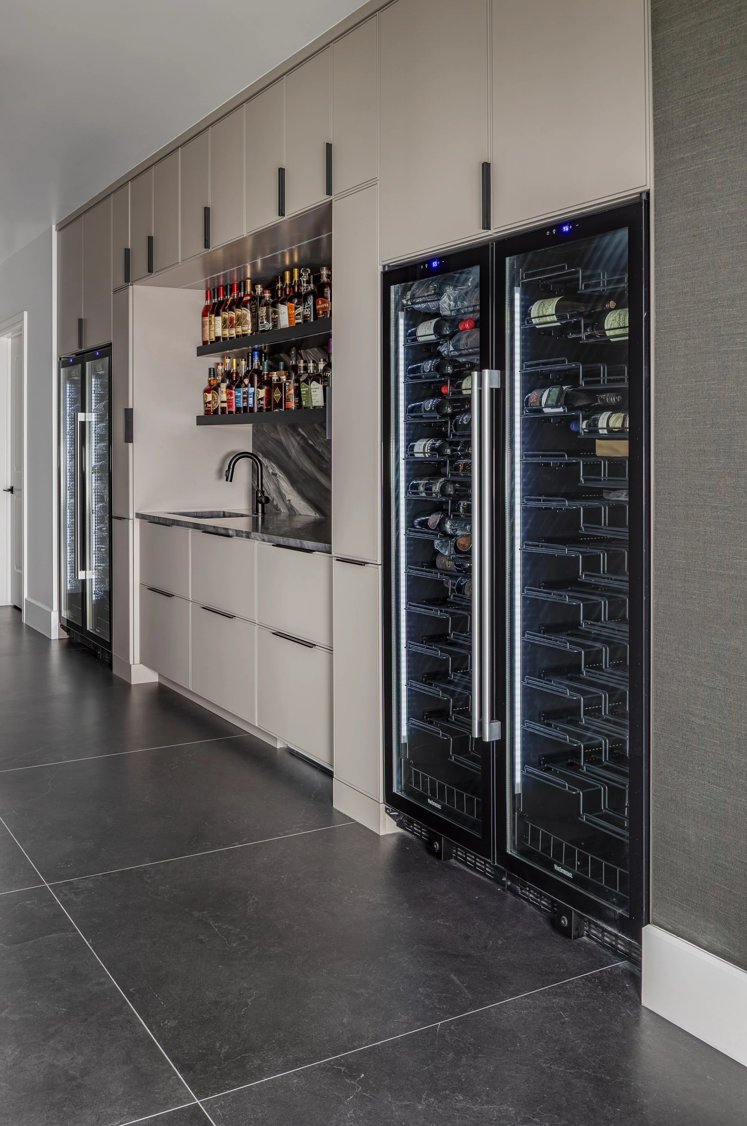 Wet Bar of a modern condo in Downtown Columbus Ohio showcasing the luxury interior design of Benham + Co Interior Design.