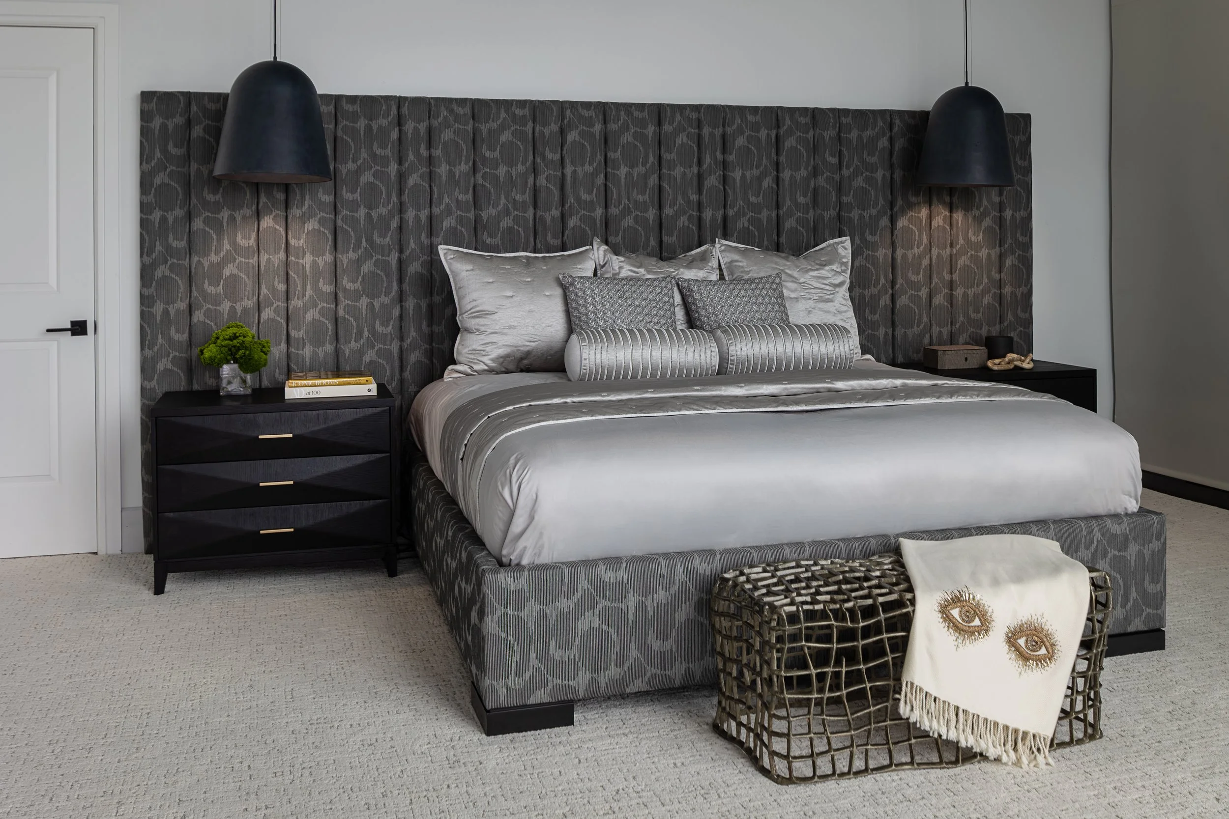 Luxury Primary Bedroom of a modern condo in Downtown Columbus Ohio showcasing the luxury interior design of Benham + Co Interior Design.