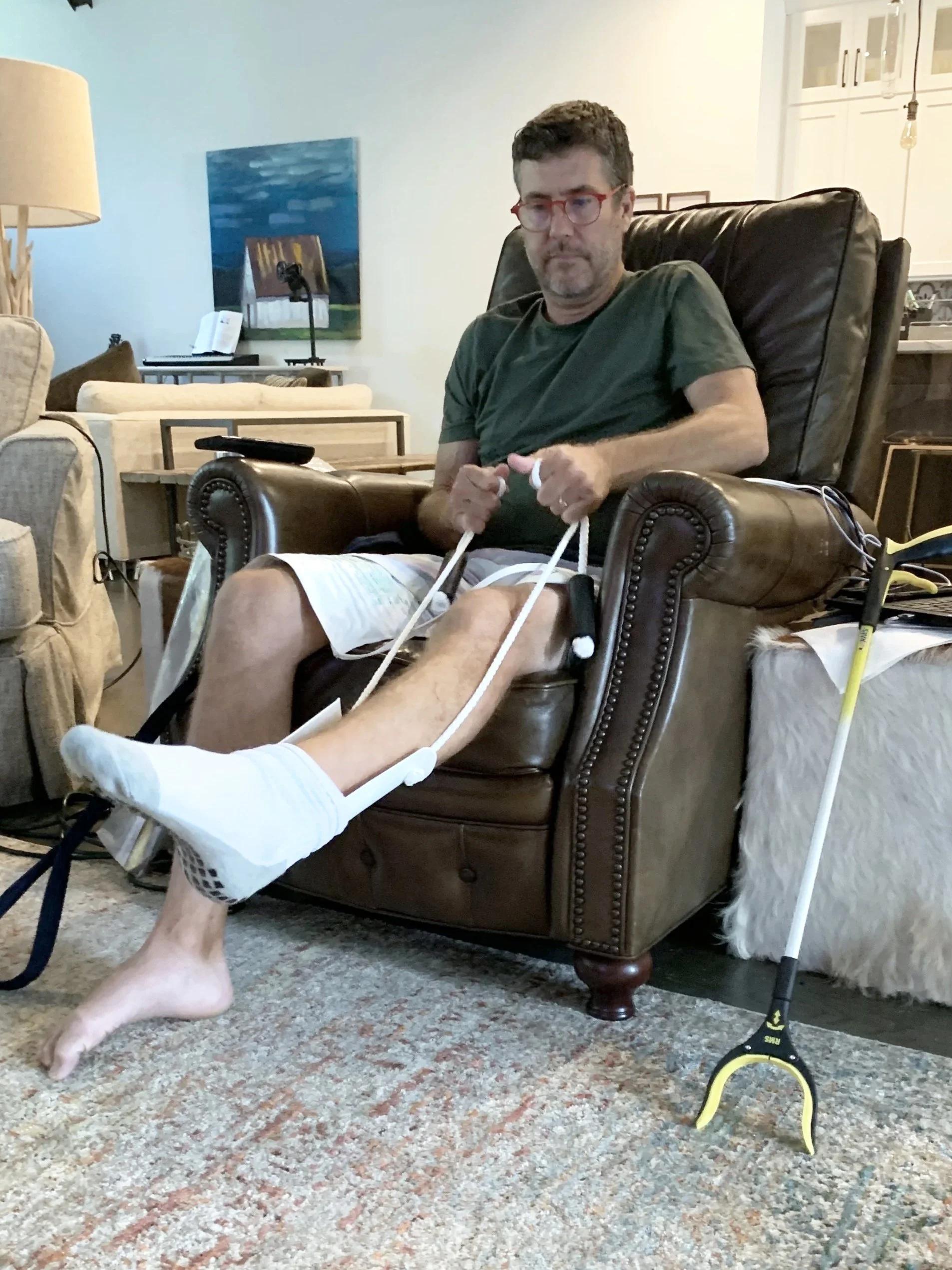 Teaching my husband to use tools to help him get dressed and be more independent. 