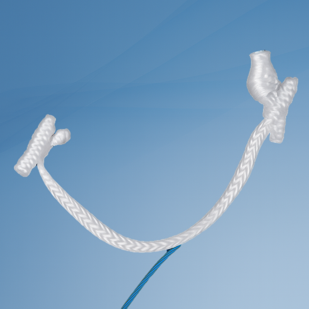 Close-up of a frayed white electrical cord against a blue sky.