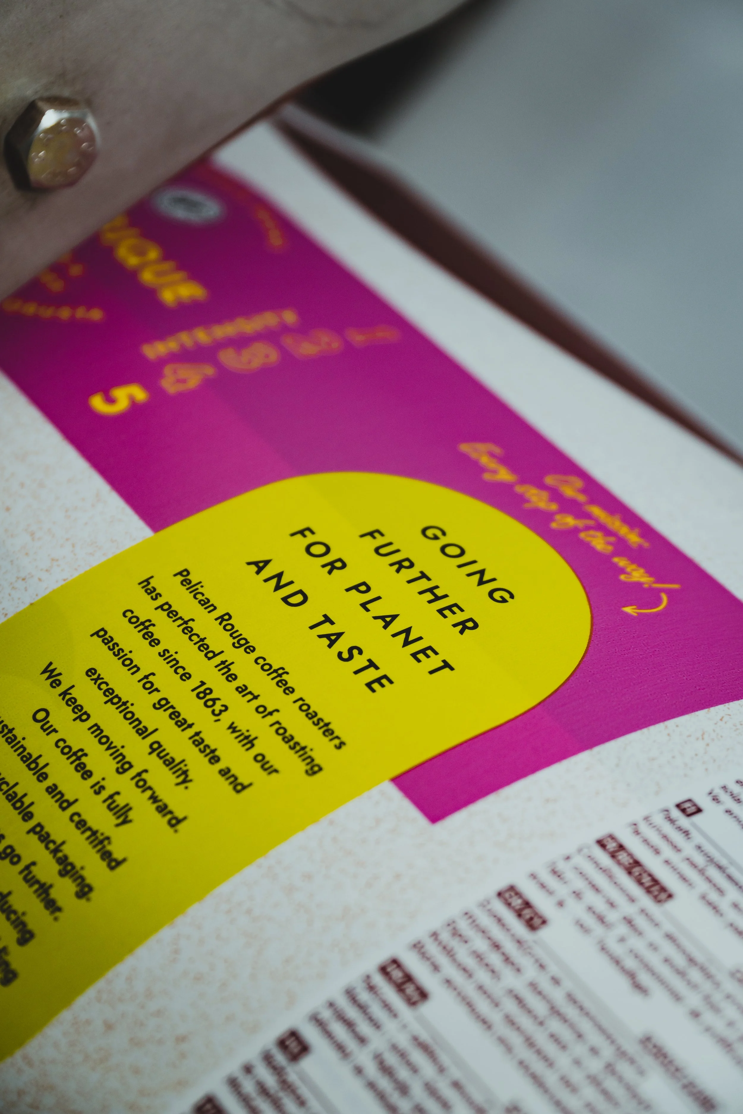 Close-up of Pelican Rouge coffee packaging with bold, colorful design and the message “Going further for planet and taste,” highlighting sustainable sourcing and premium roasting craftsmanship..jpg