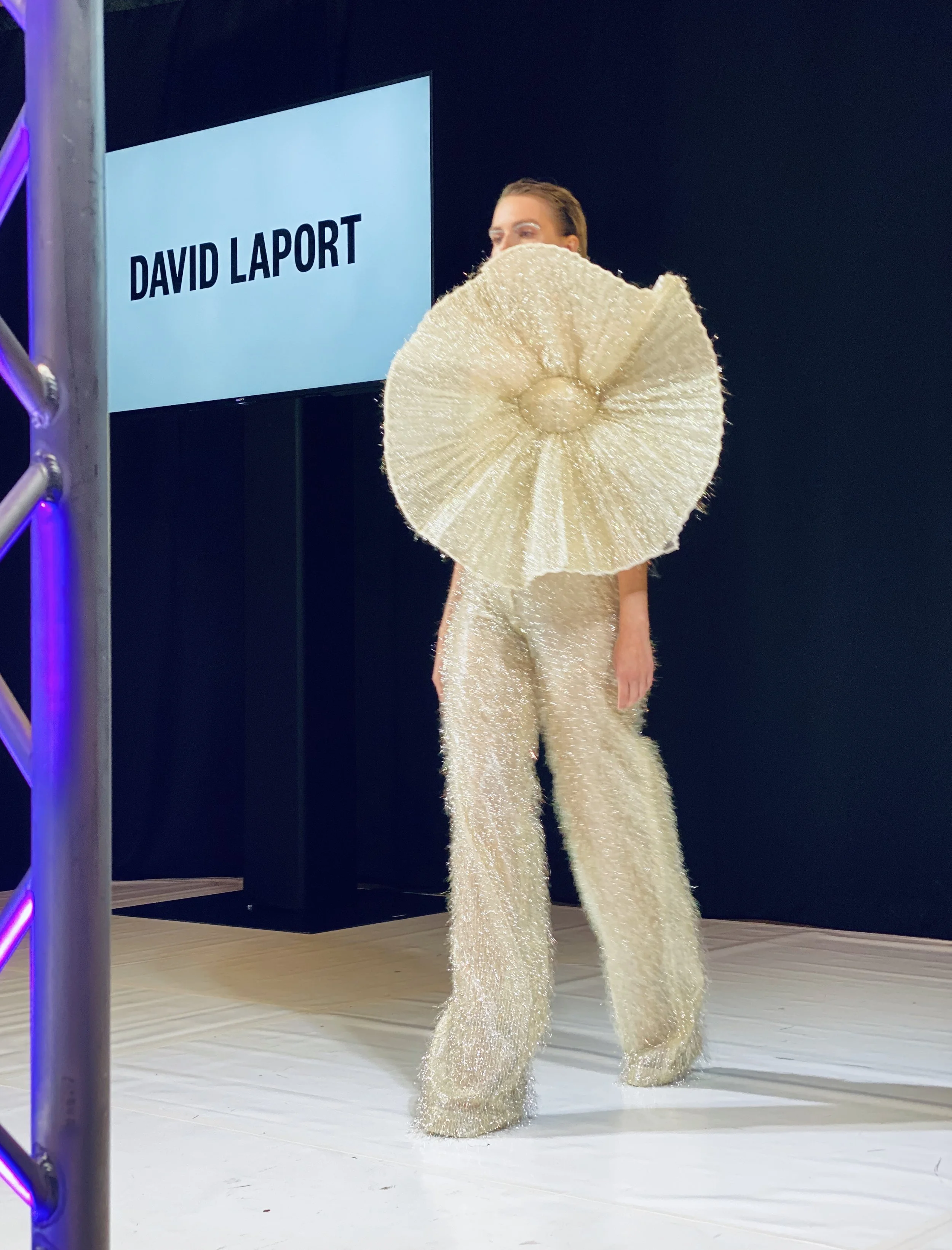 Minimalist runway scene with a statement couture dress, combining texture, structure and modern design. A bold expression of contemporary fashion and craftsmanship..jpg