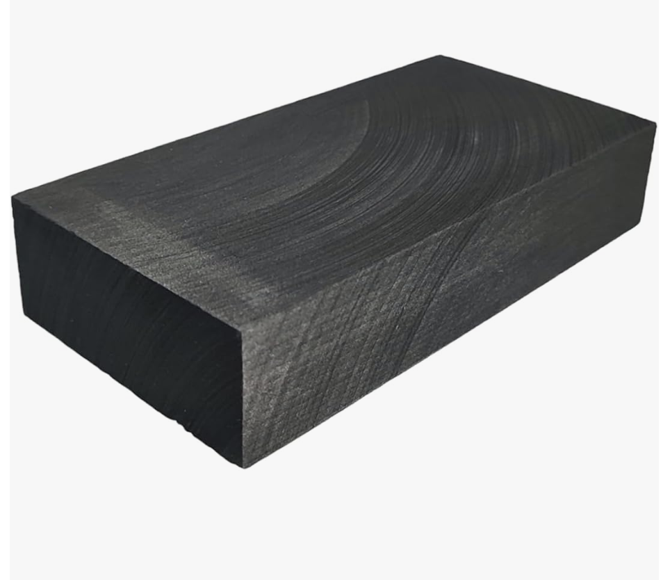 A 5.5-inch natural charcoal soldering block in a lime-wood holder for artisanal jewelry making and metalwork at the M7 Trading Post.