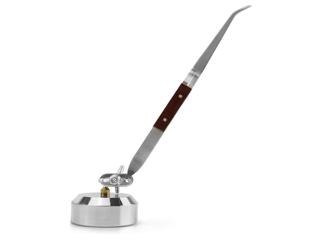 A 360-degree rotating third hand soldering station with cross-locking tweezers used for precision jewelry making at the M7 Trading Post.