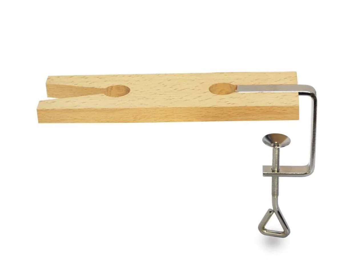 A hardwood V-slot bench pin with a C-clamp mount for portable jewelry and metalworking support at the M7 Trading Post.