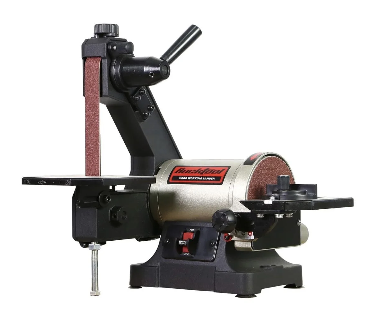 A 1x30 inch bench belt sander and 5 inch disc sander combo with a 1/3HP direct drive motor, positioned on a jewelry studio workbench.